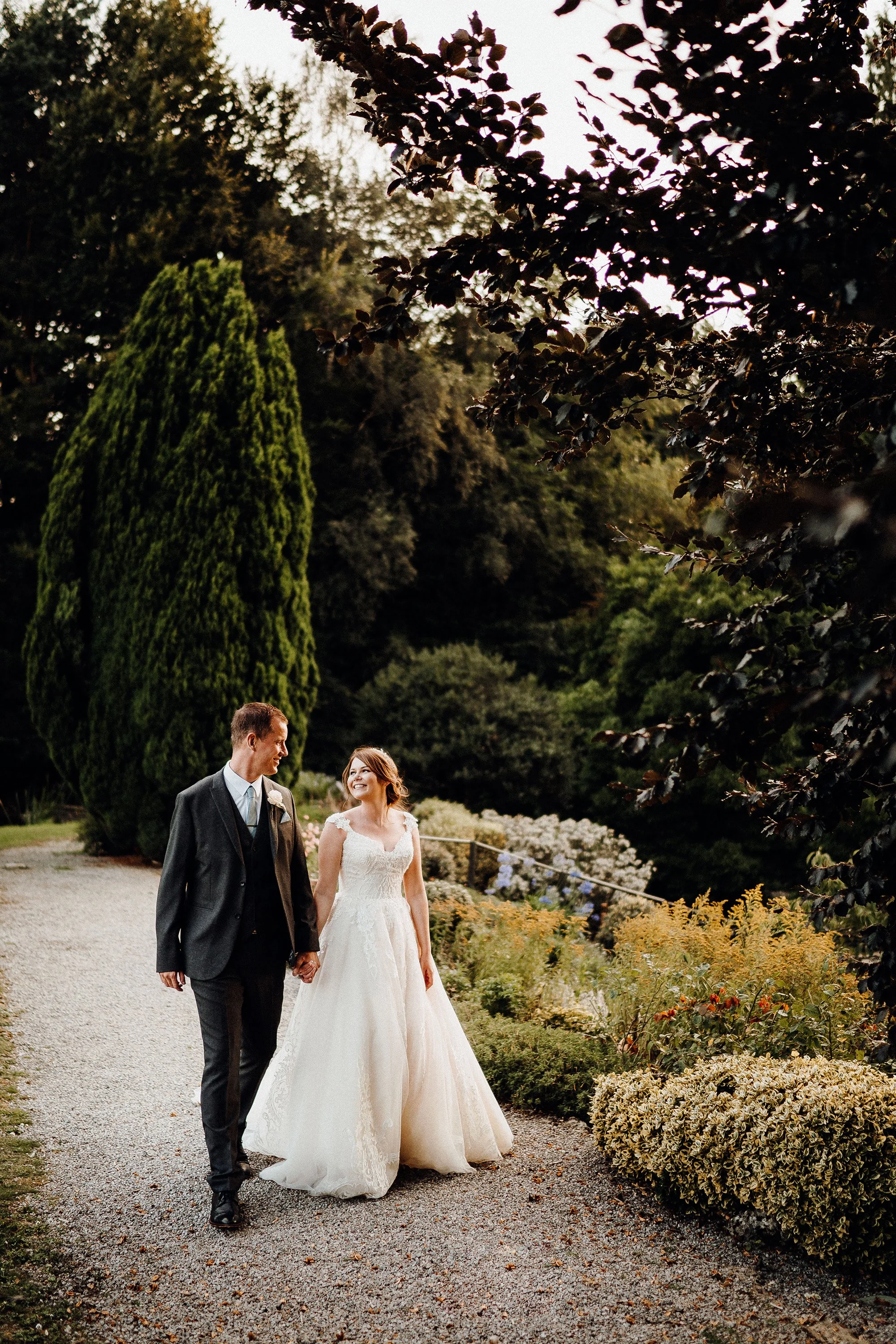 bride and groom shot walking and smiling