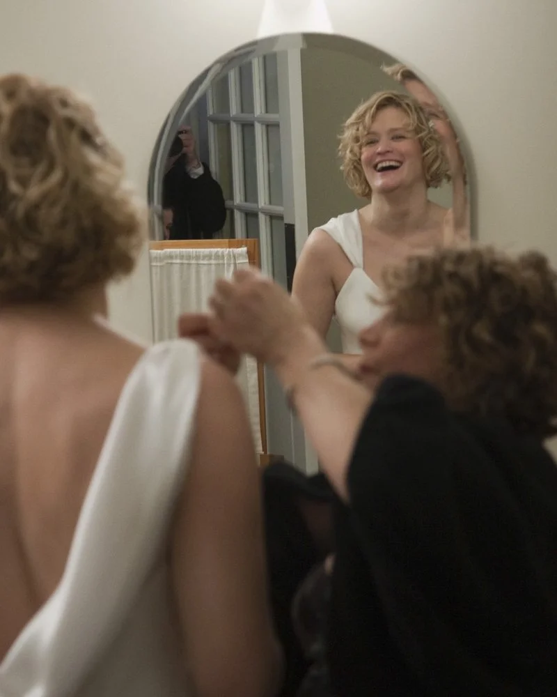 Laughing bride in mirror.JPG