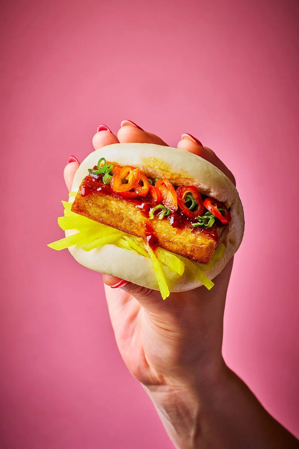 FoodPhotographerLondon_CharlotteNott-Macaire_SevenDialsMarket_SiachuanPorkBao_YumBum_HandHeld.jpg