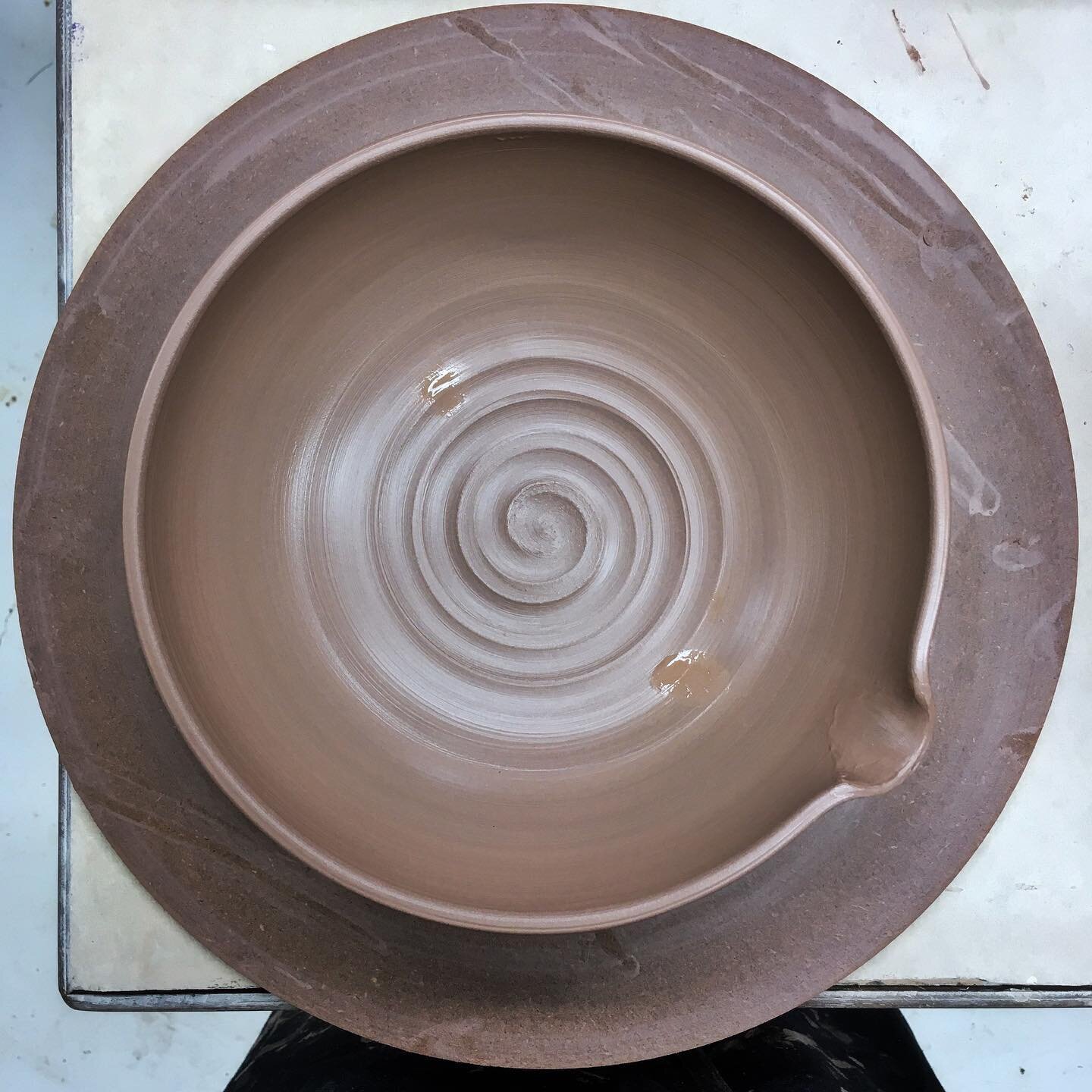 The last one of these I made slipped right out of my hands and shattered on the concrete floor when I was glazing it. So this is Take Two.

Freshly thrown pouring bowl&mdash;it&rsquo;ll get a big comfortable handle opposite the spout, and will be abo