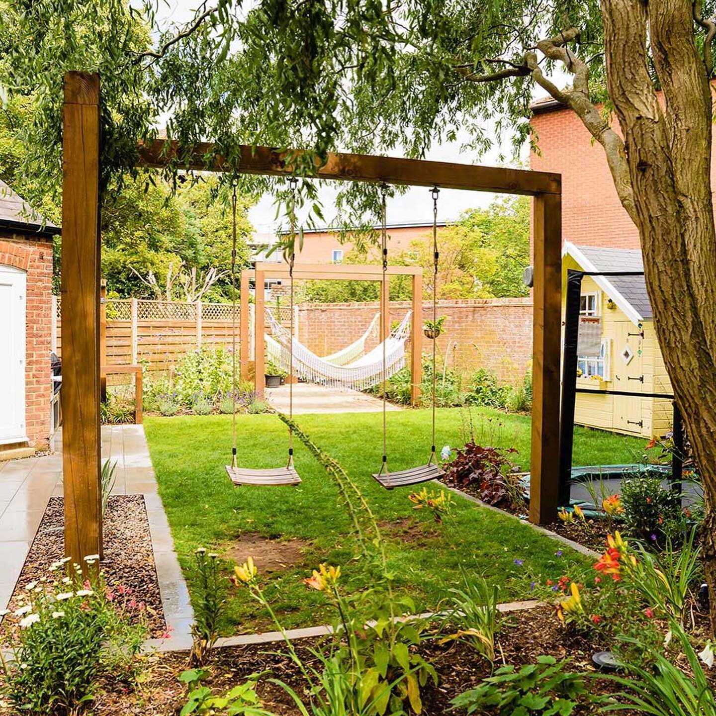 Fun Family Garden - One of our favourite gardens of last year was for a lovely family in St Albans who had recently completed renovations on their family home. Highlights are the custom-built hammock and swing arches complete with rain-drop feature, 