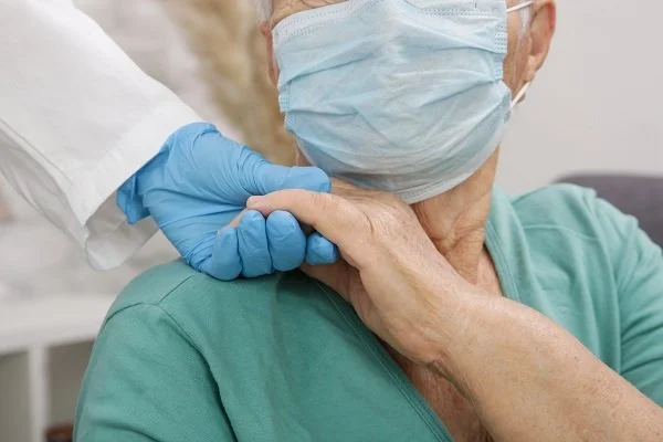 Doctors clasping hands in gratitude showcasing healthy aging after COVID-19