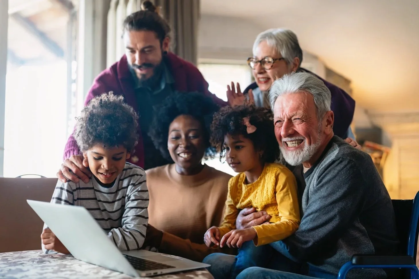 Diverse group of cultures and ages laughing joyously together