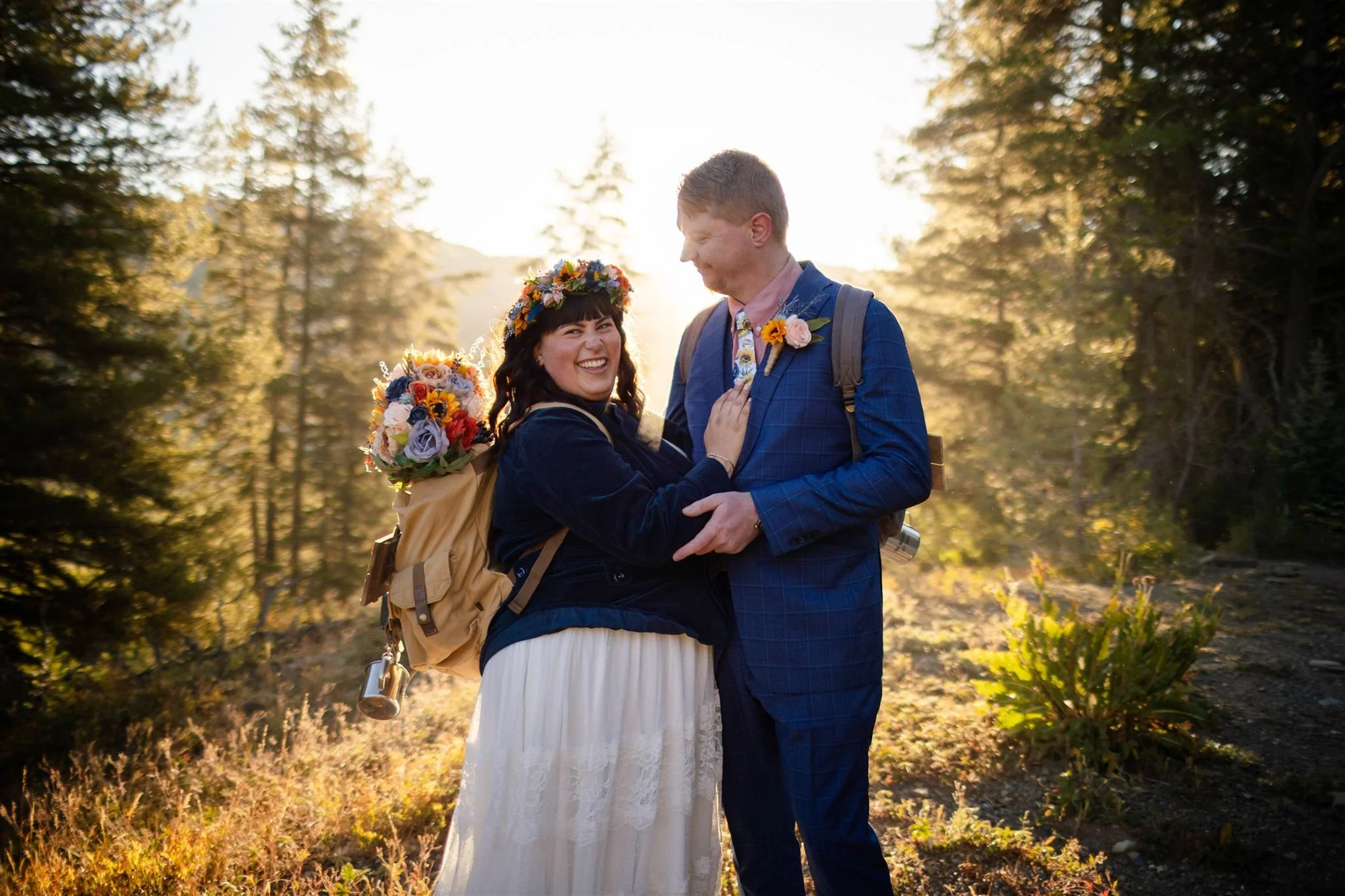 bride and groom backlit by morning sun during crested butte elopement