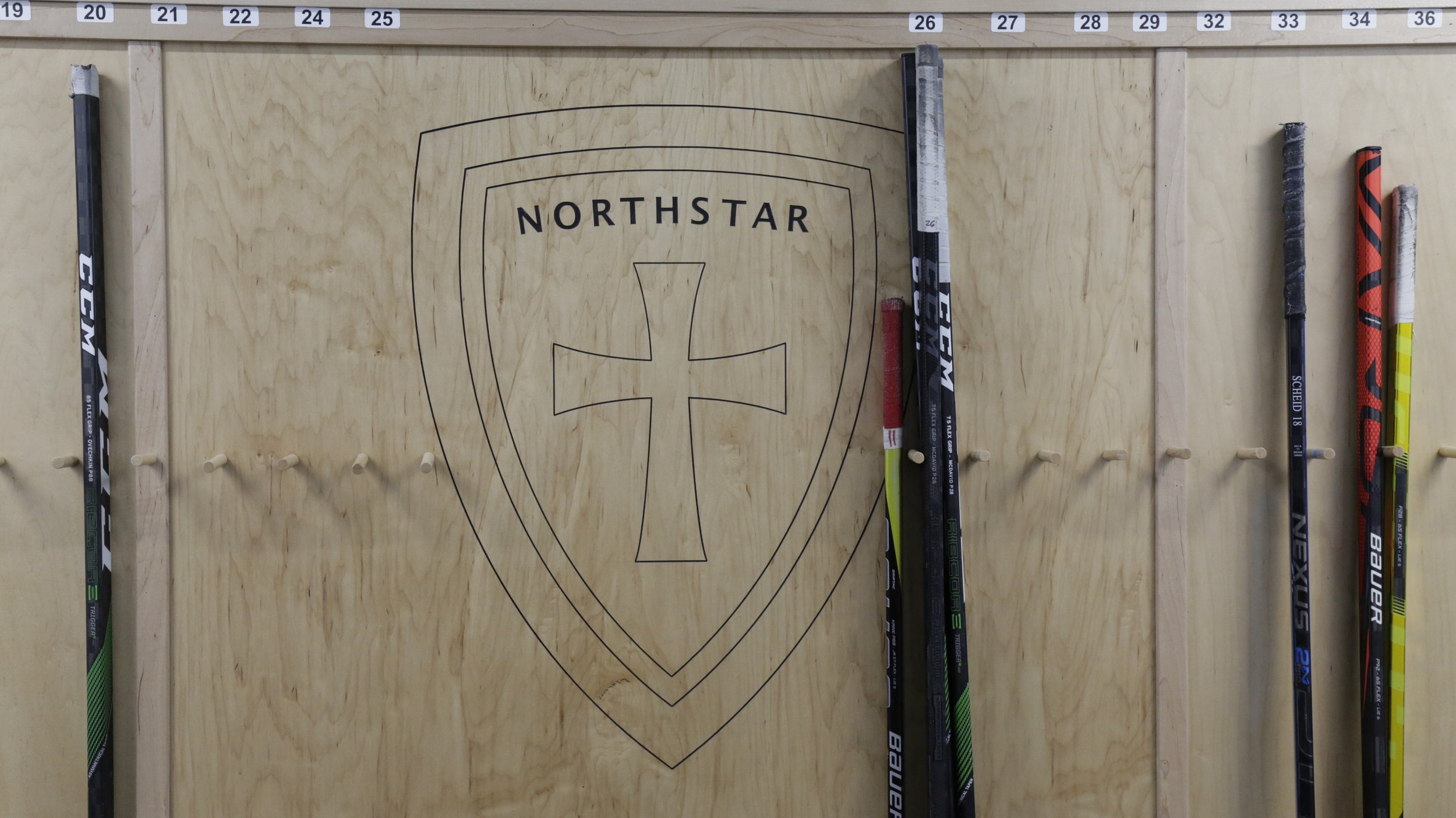 Closer Look at Engraved Logo on Hockey Stick Holding Area