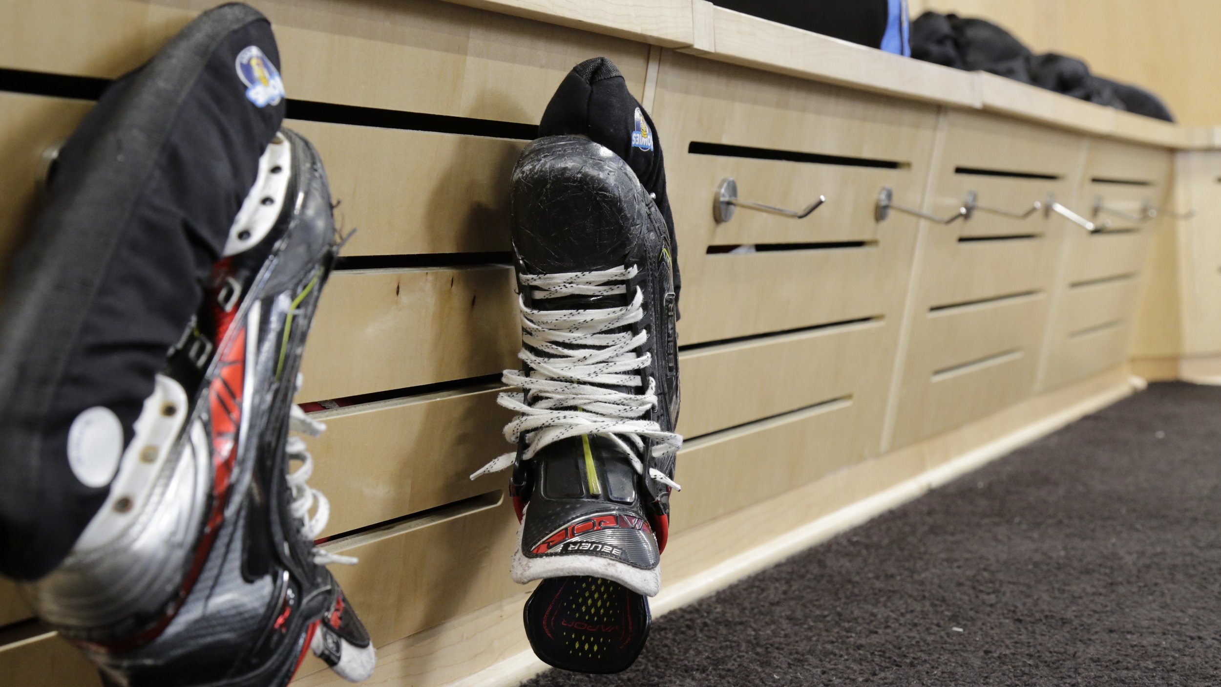 Closer Look at Skates Hanging on Lower Part of Lockers