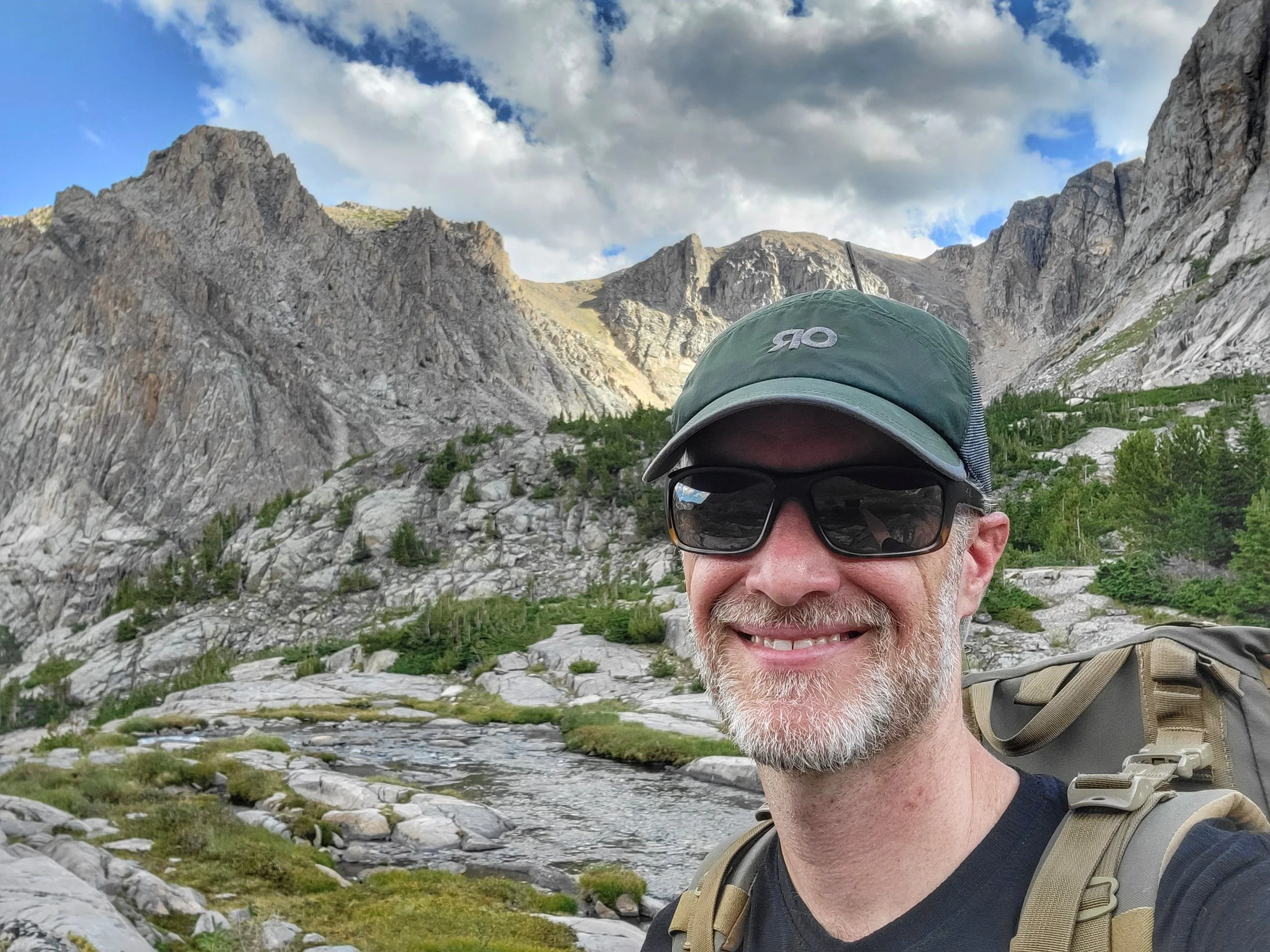 Image of Shaun Durkee, smiling in front of mountains