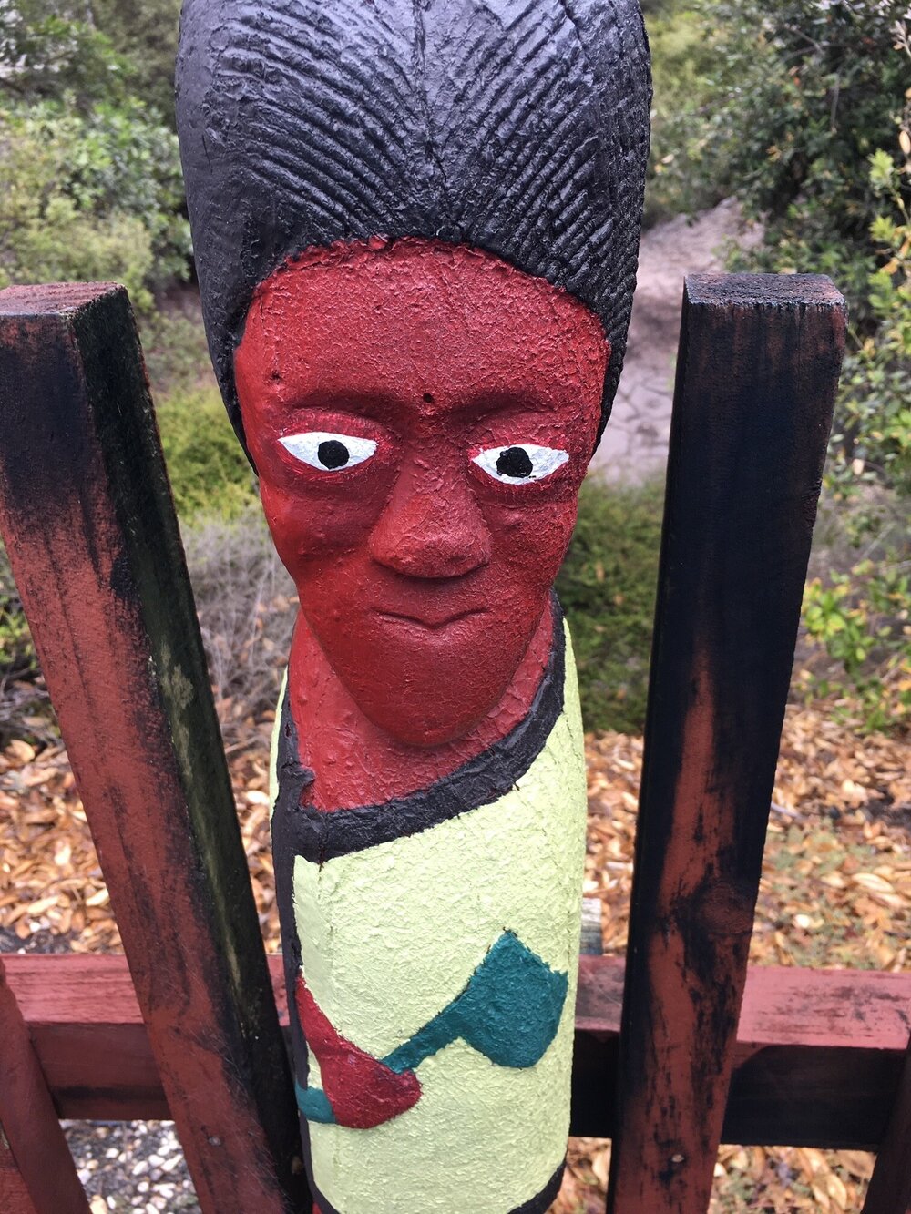 maori village - red wood statue.jpg
