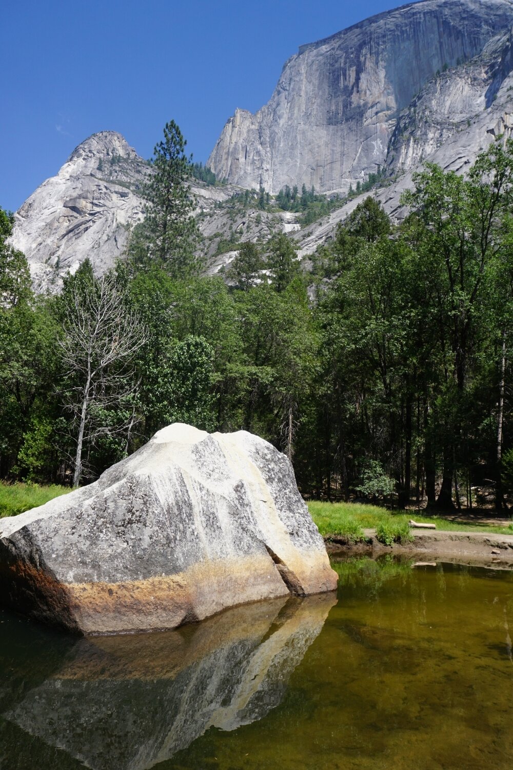 Mirror Lake reflecting Half Dome - hiking trail in Yosemite National Park