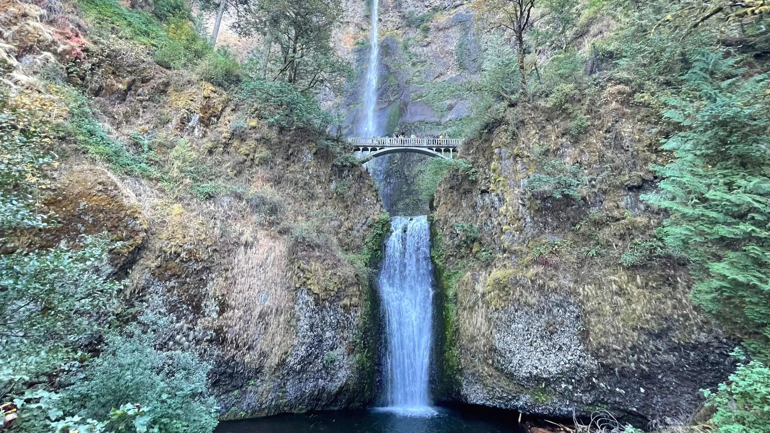 An iconic Oregon waterfall with two layers and a bridge