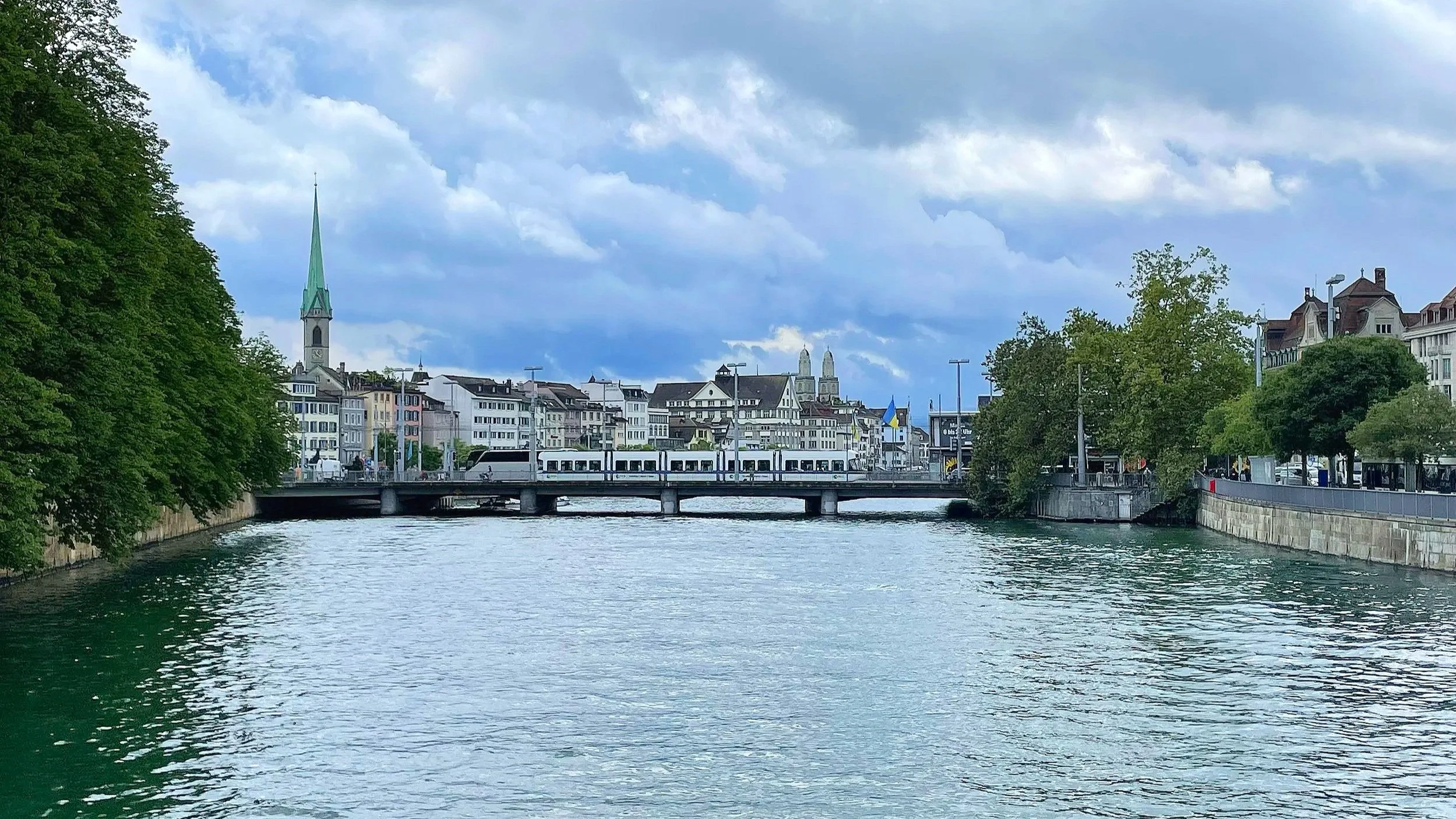 A view of two churches from a bridge over the river in Zurich, Switzerland