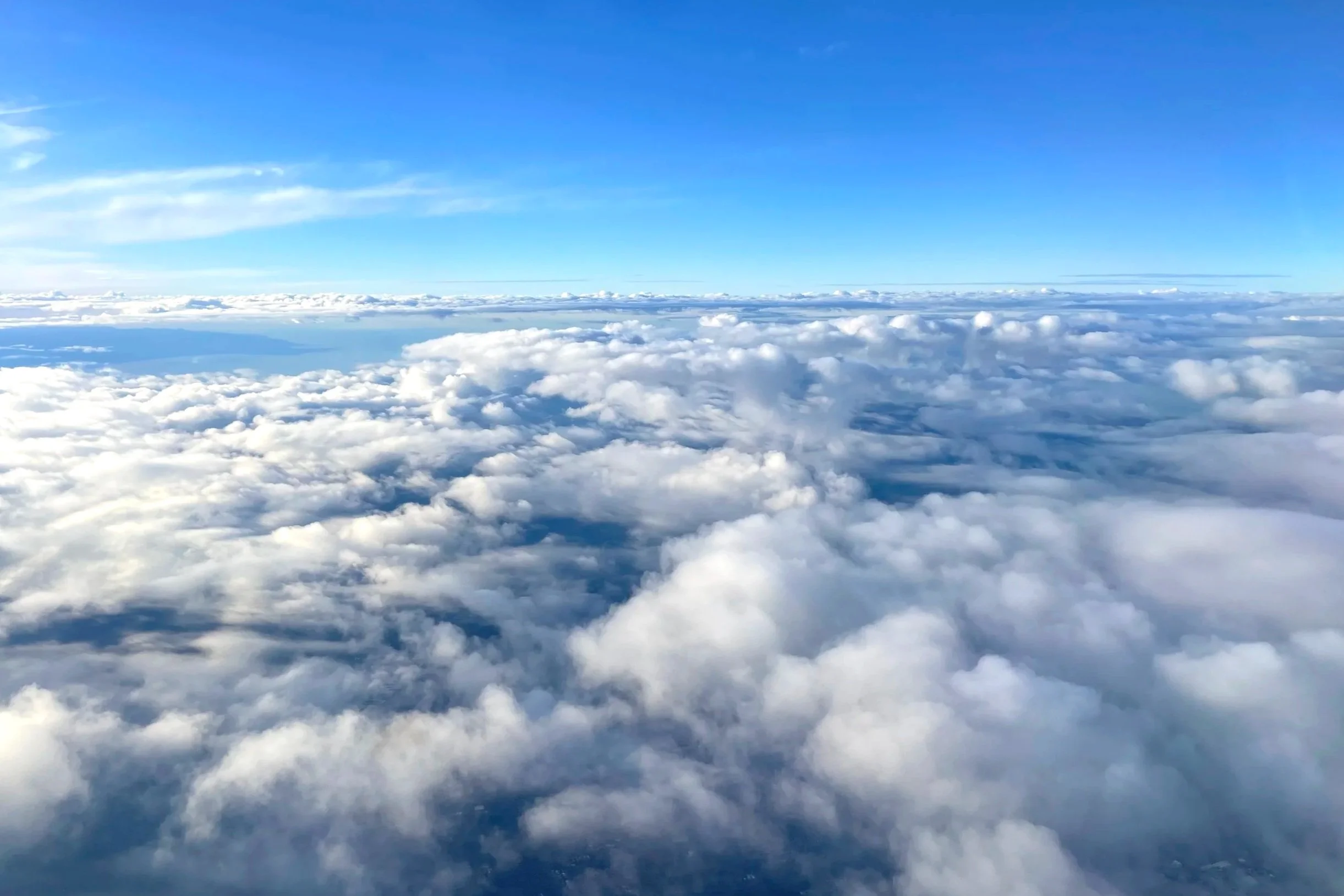 Clouds in the sky are seen at eye level, filling the horizon.