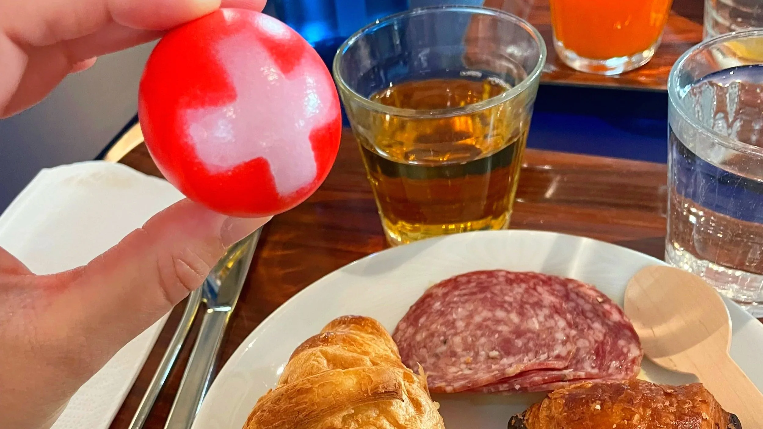 An egg is decorated with the Swiss flag at a Swiss breakfast in Zurich, Switzerland