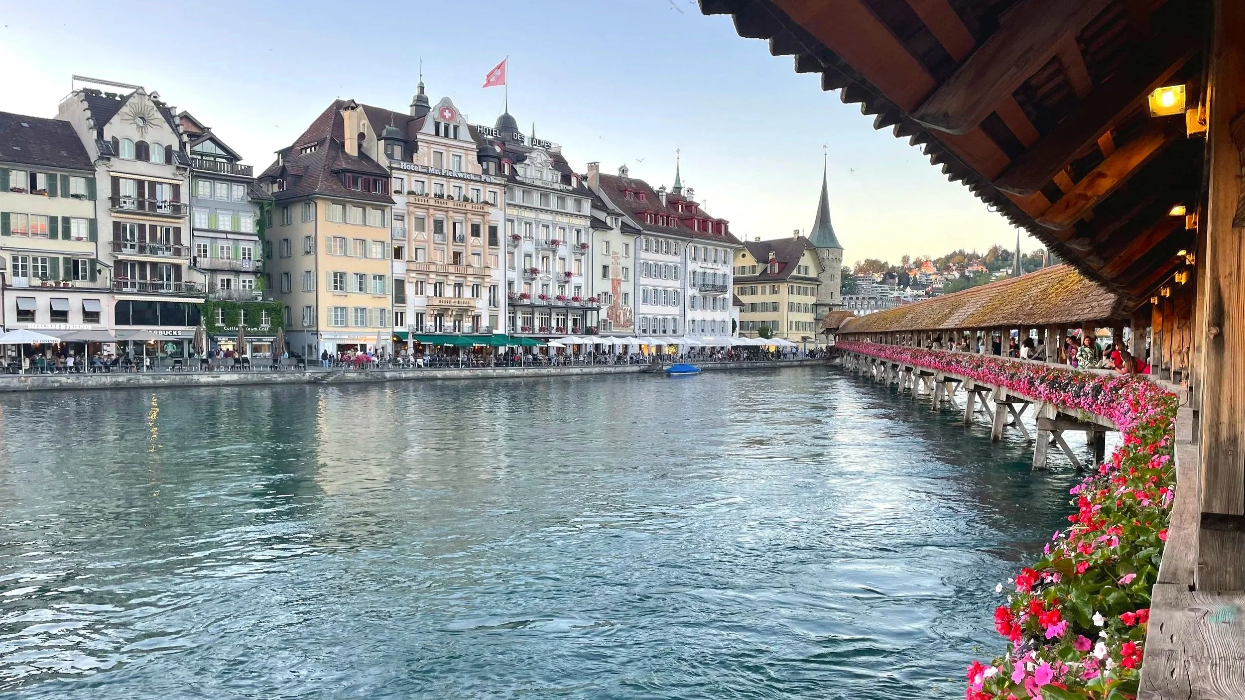 The Lucerne bridge is lined with bright flowers