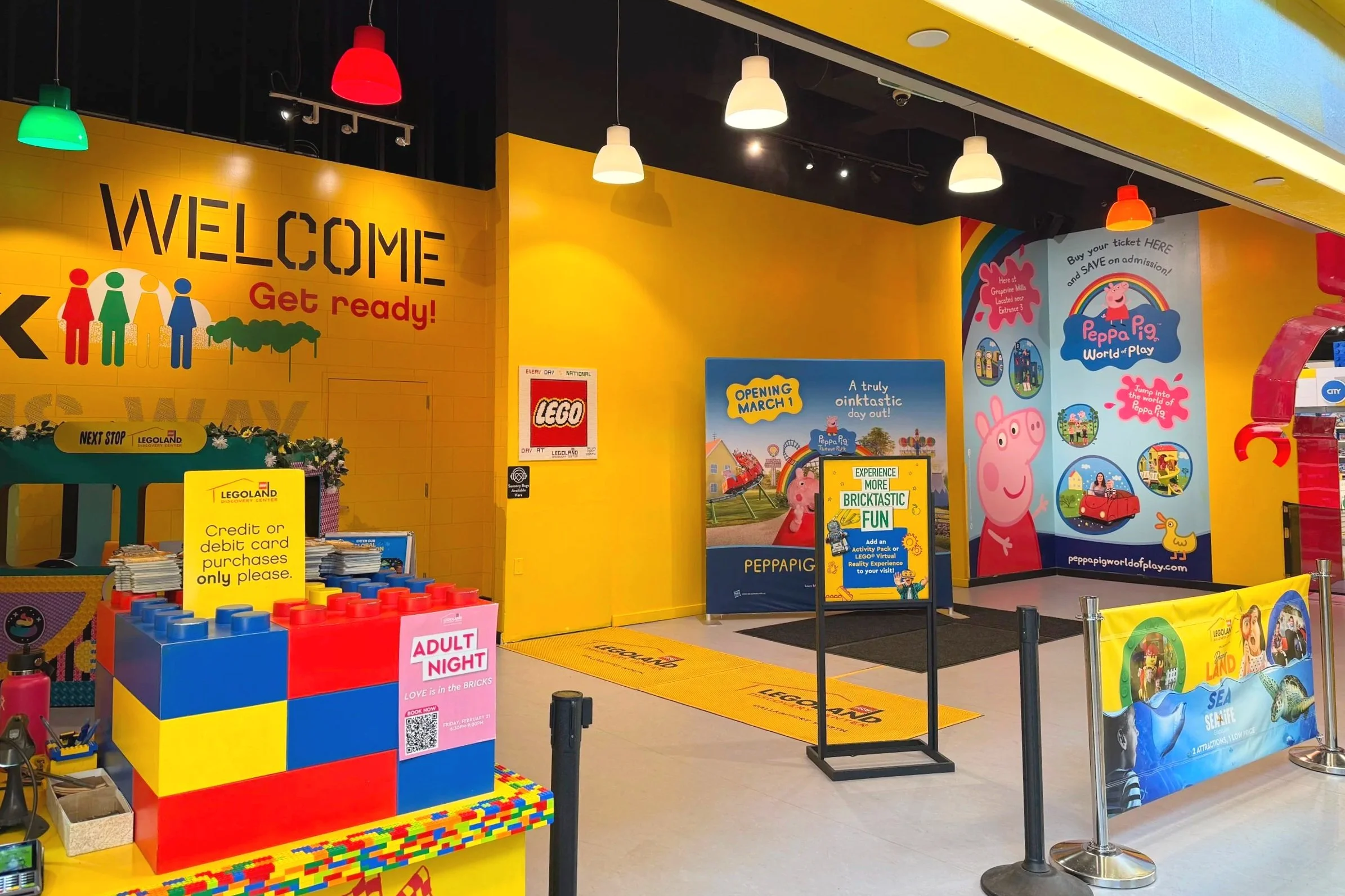 Legoland and Peppa Pig World entrances with yellow walls and fun signs at Grapevine Mills.