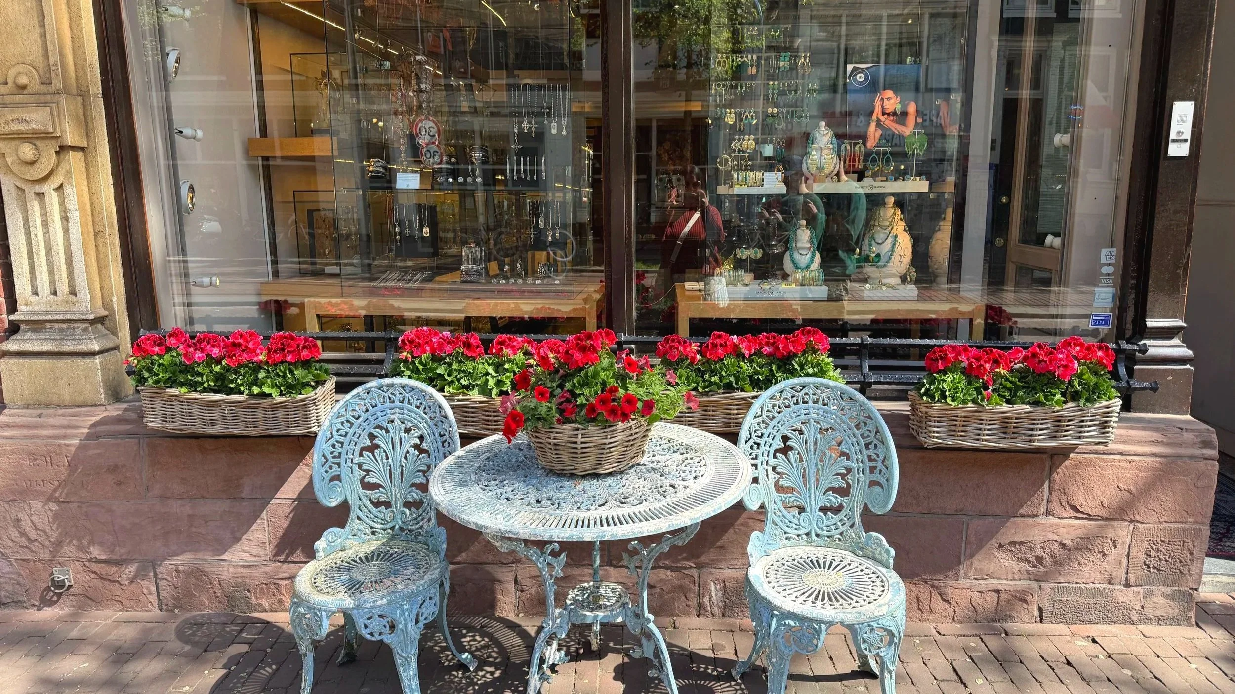 Window shopping in Amsterdam with flowers and decorative furniture