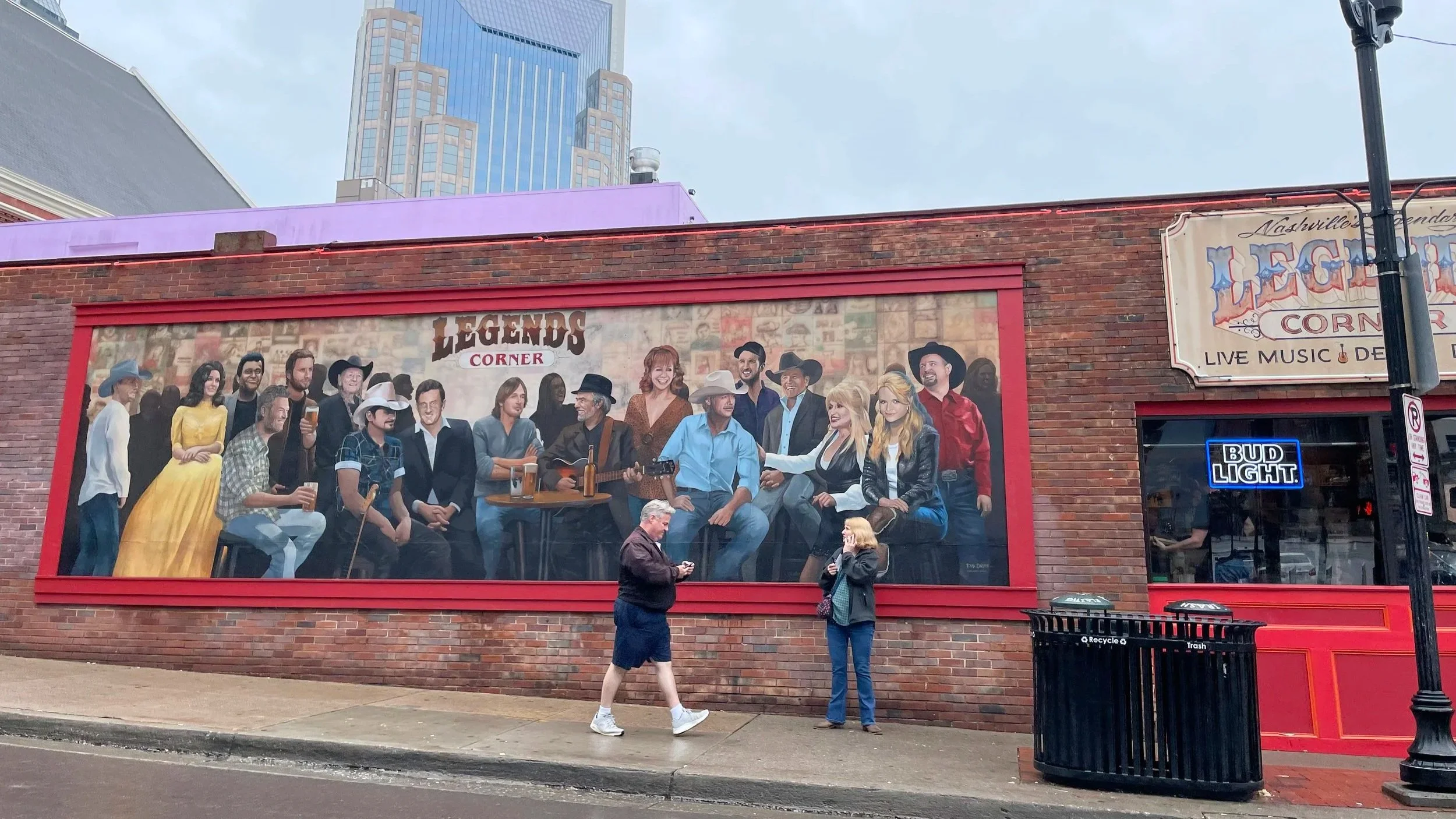 A famous bar in Nashville showcases a mural with singers who performed in Nashville.