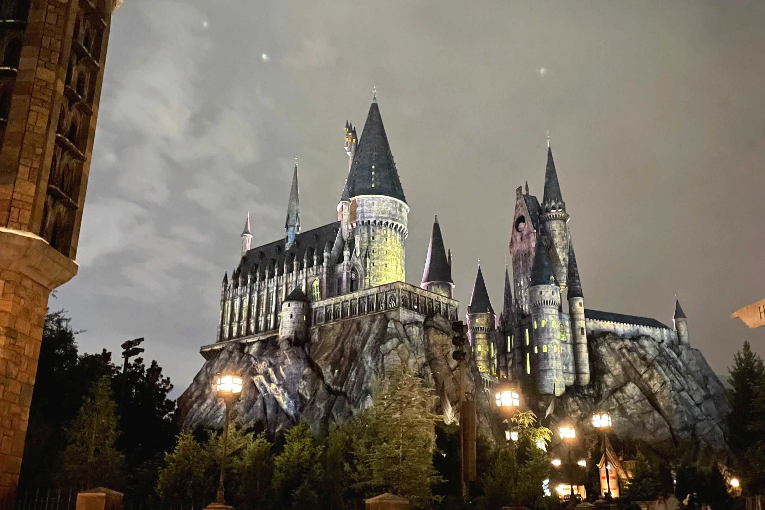 the Hogwarts Castle is lit up at a night in Universal Orlando, Islands of Adventure.