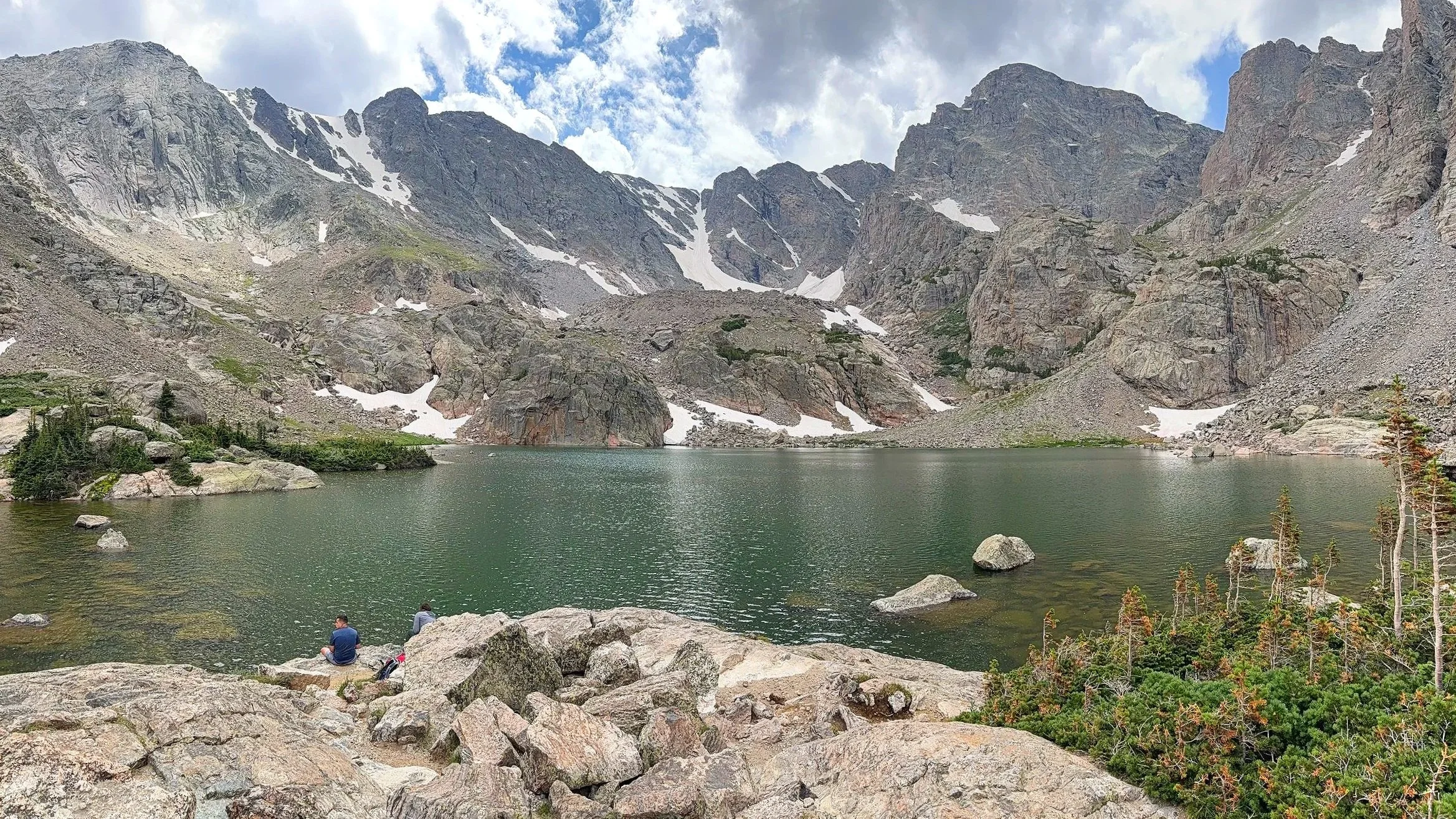 A lake with snowy mountain backdrop at Rocky Mountain National Park.