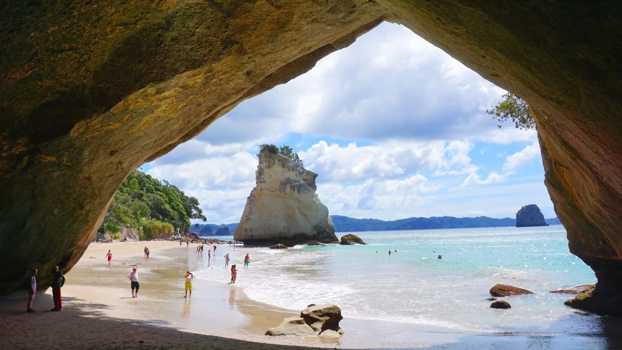 Cathedral Cove opens up into views of the ocean in Coromandel, New Zealand