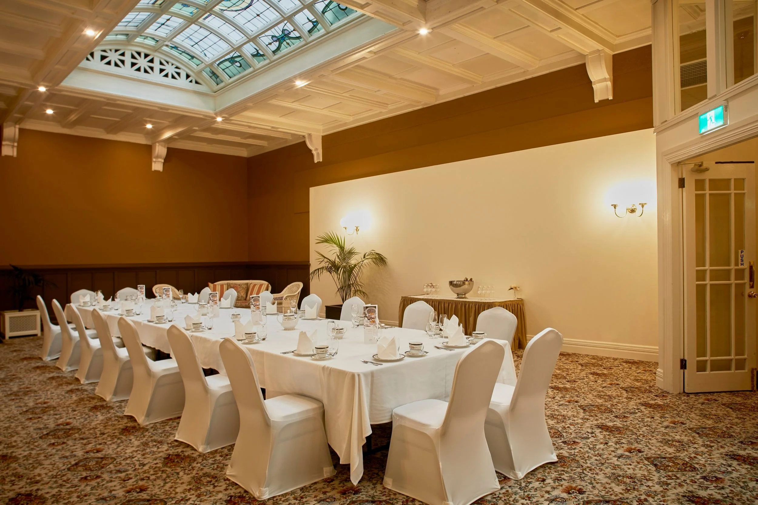 Leadlight private event room with large dining table and natural light from the leadlight ceiling
