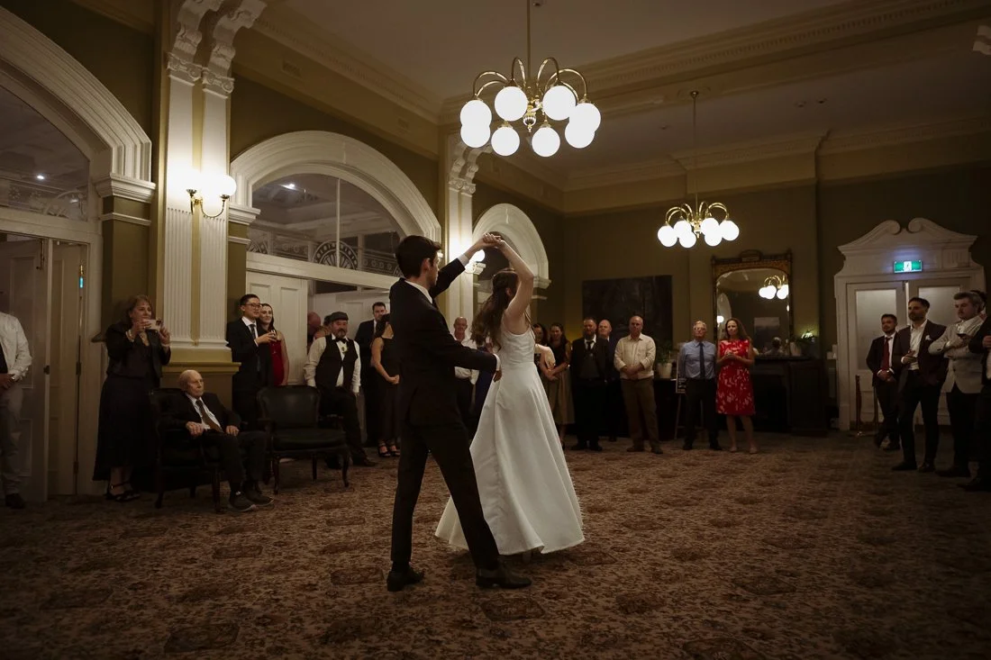 Bride and groom dance at wedding reception in the Mary Hadley Room at Hadley's