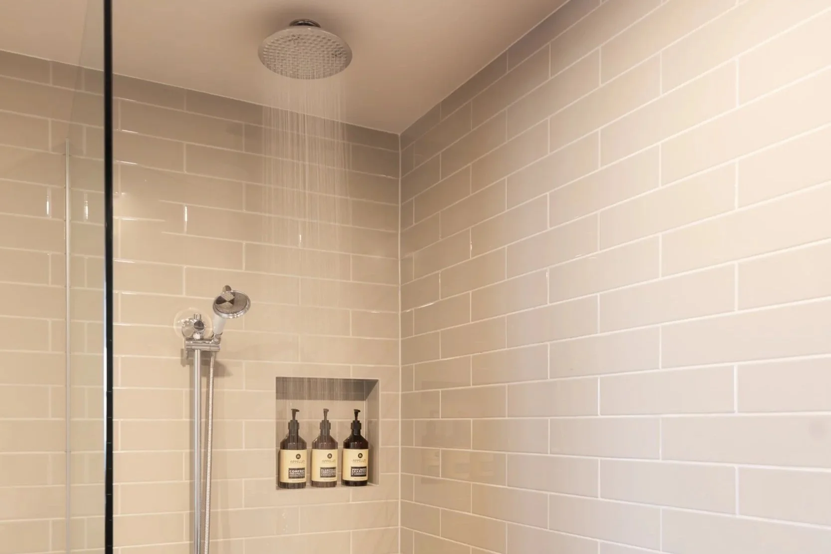 Modern bathroom at Hadley's with walk-in shower and rainwater shower head