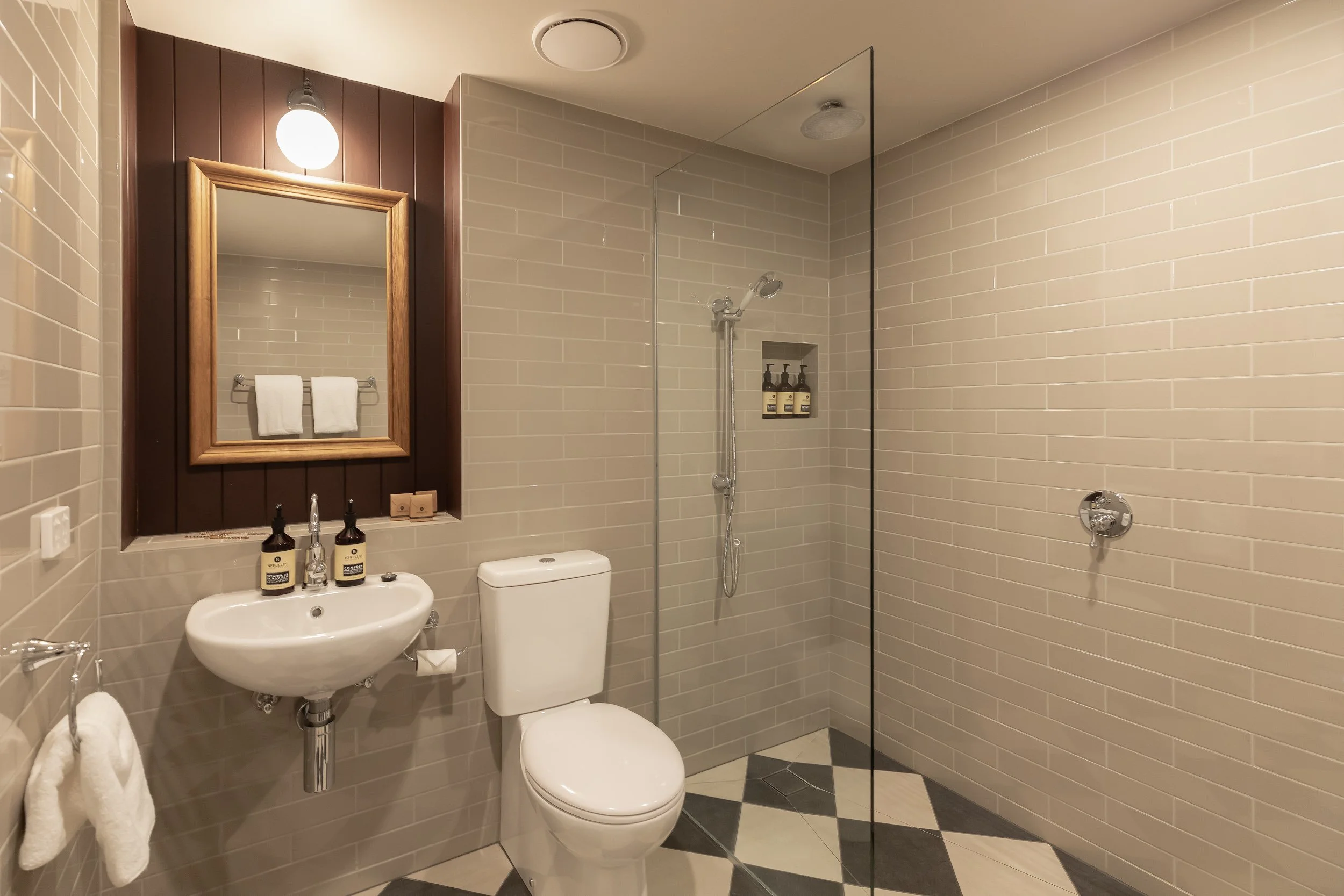 Modern bathroom at Hadley's with walk-in shower and rainwater shower head