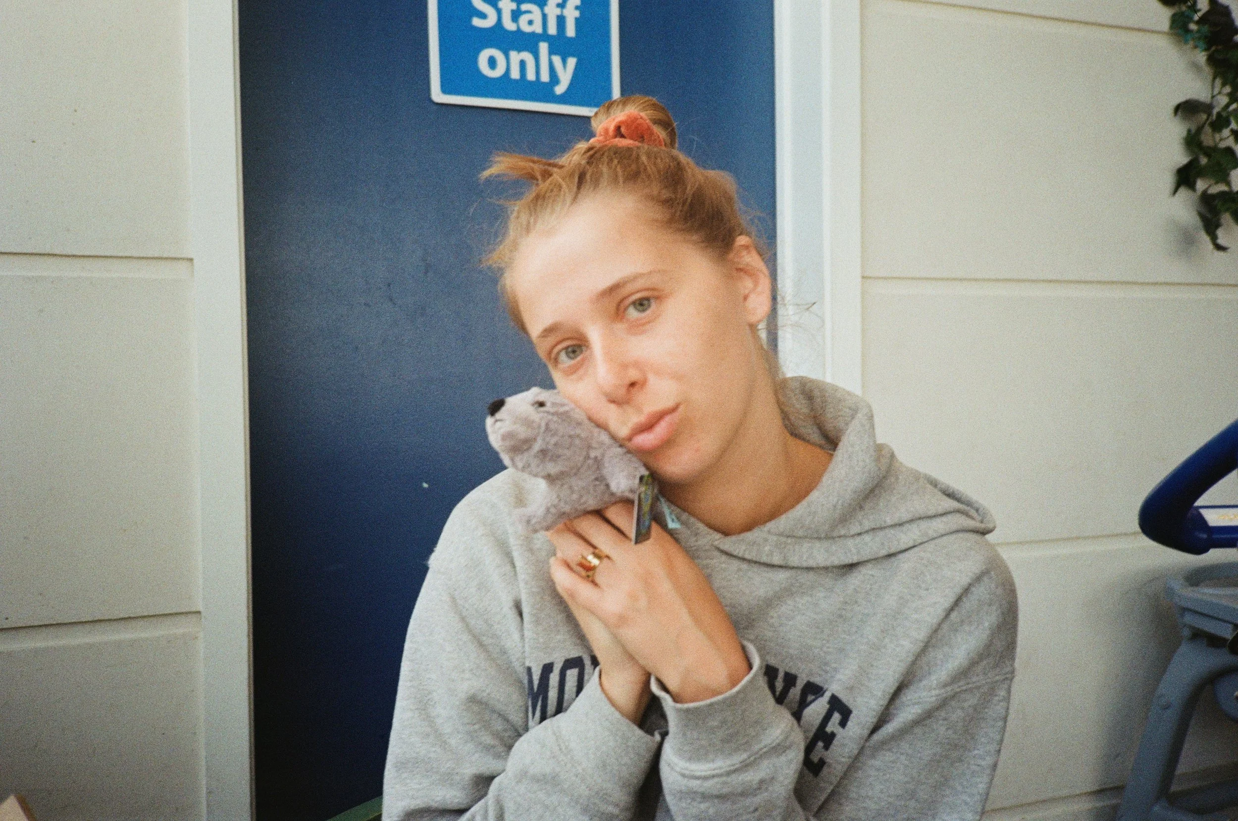 (Auckland Airport) - Christina with Bobbie our new family stuffed animal mascot. All of us have a bobbie. 