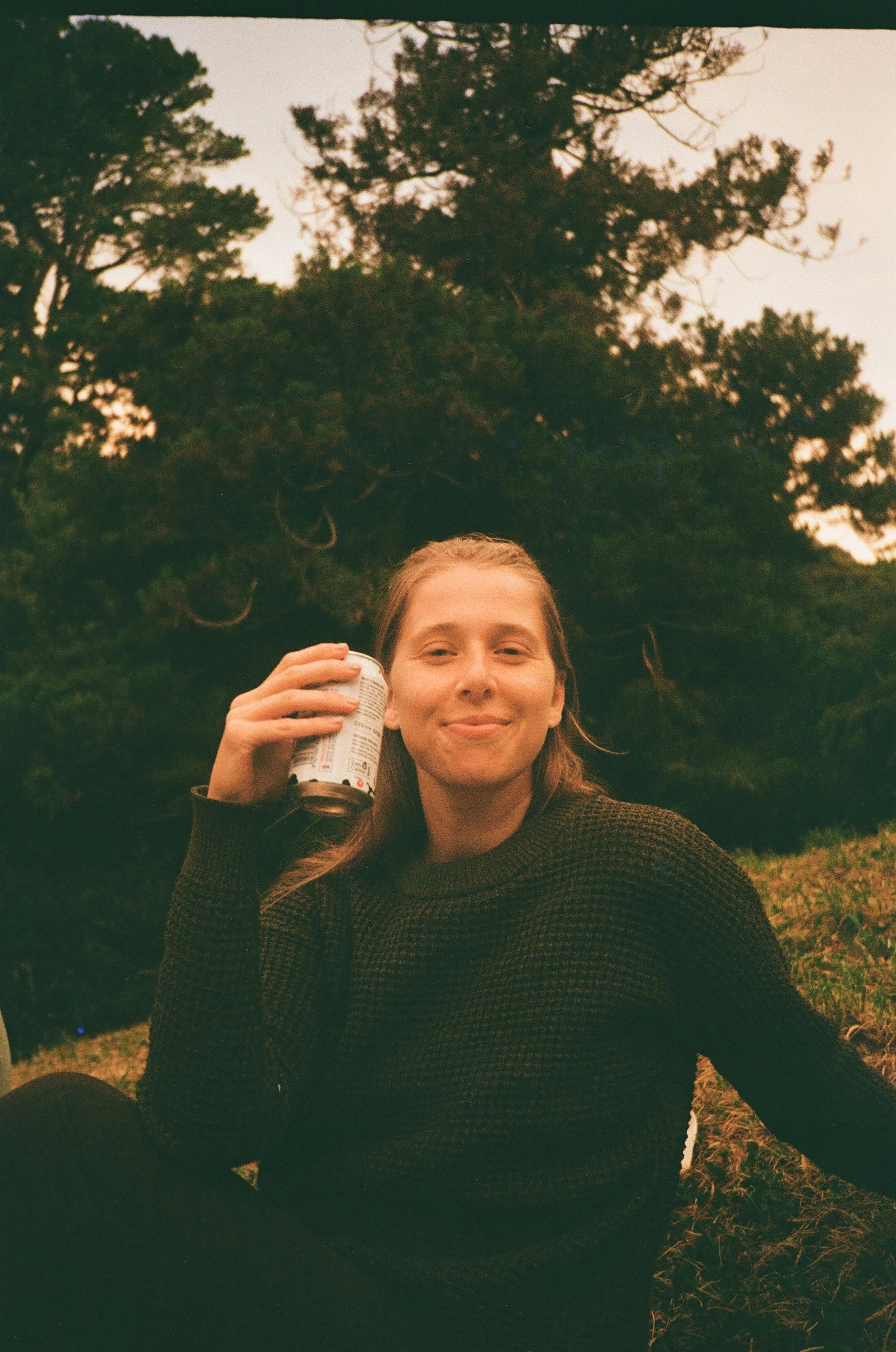 (Wellington) - We all got takeaway and sat at a park watching a local music performance. Christina drinking one of our favorite beers from a local brewery called Garage Project.