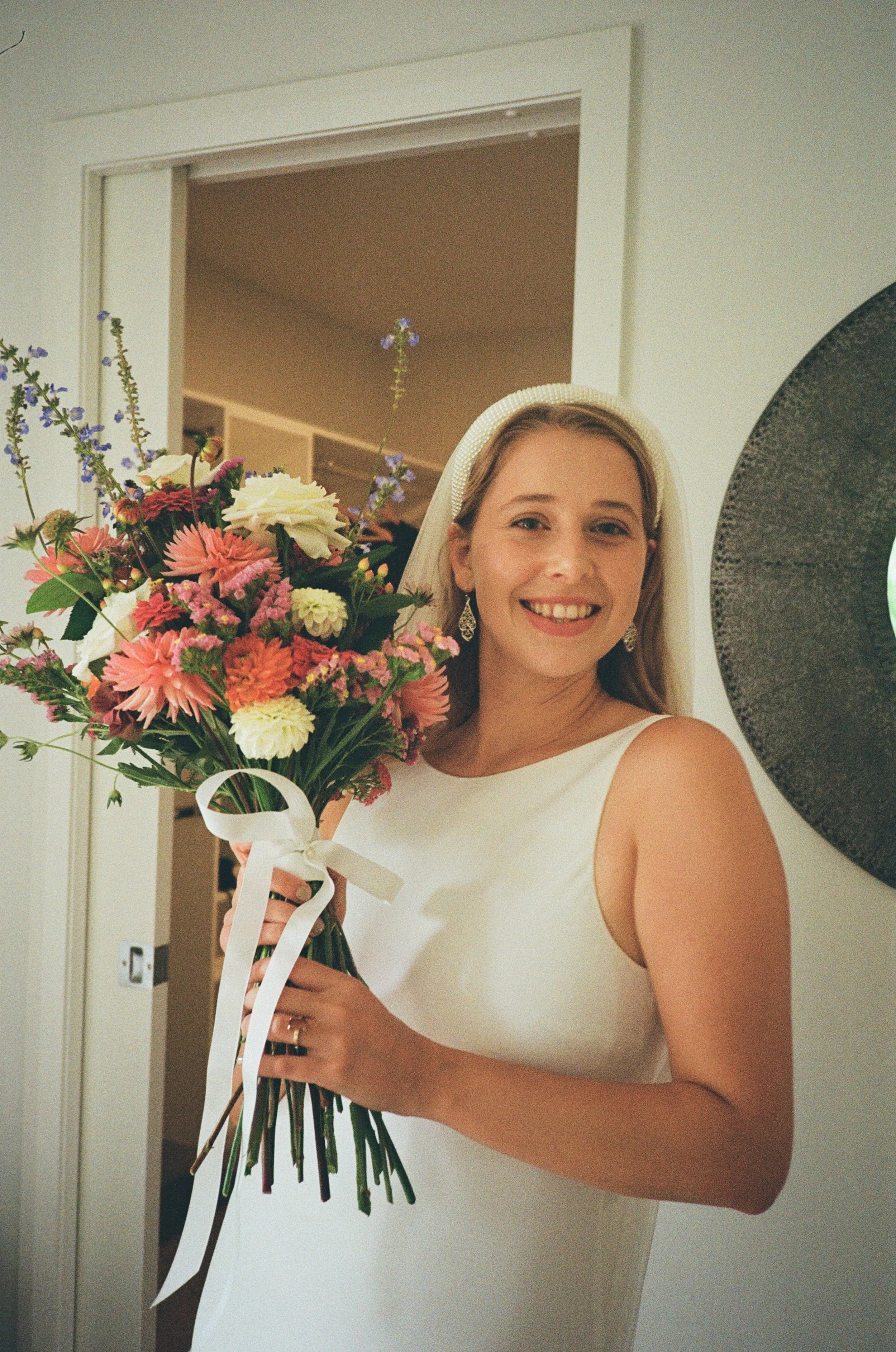 (Tauranga) - Getting ready for the wedding. Christina all dressed and with her bouquet.