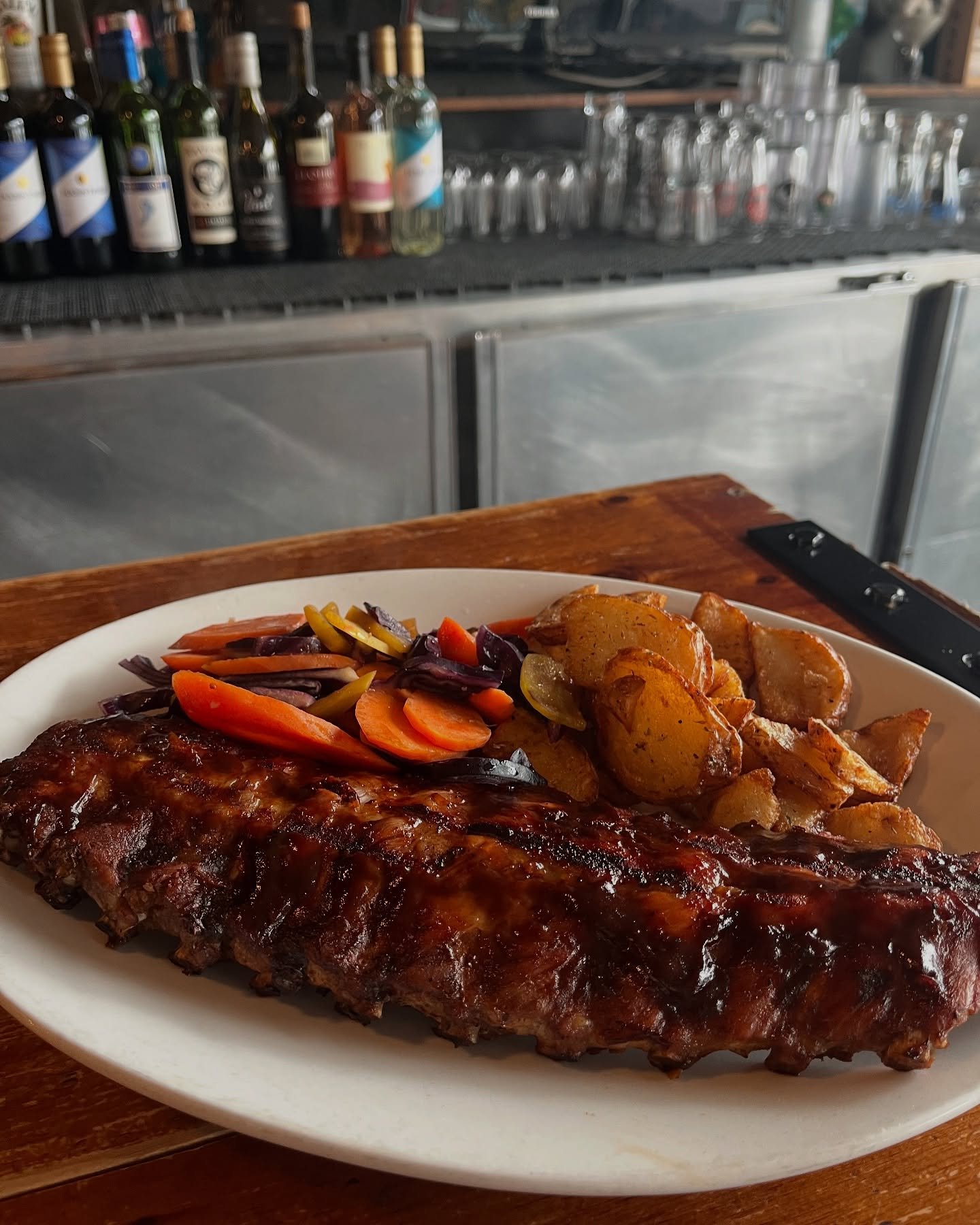 B.B.Q. Baby-back Ribs🍖 
~ Baby-back ribs broiled in barbecue sauce, served with a starter side salad, dinner potatoes, and seasonal vegetables ~