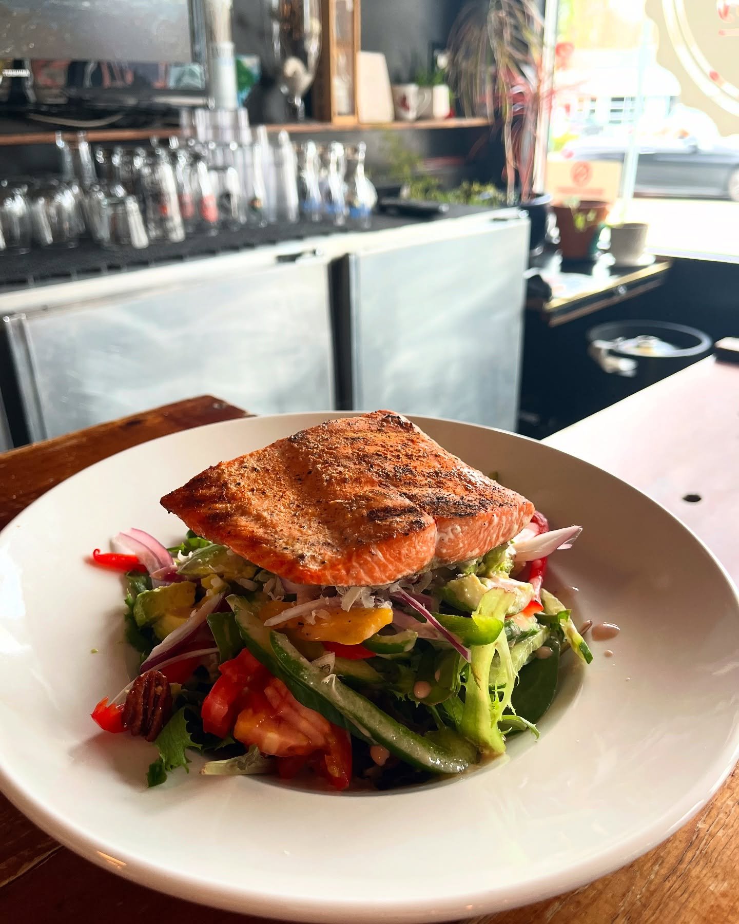 Tippers Big Salad 🥗 
~ Spring mix, fresh veg, creamy avocado, and in-house candied pecans topped with Reggiano and red wine vinaigrette. Very popular with grilled salmon (as pictured), chicken breast, or 7oz striploin grilled to your liking ~