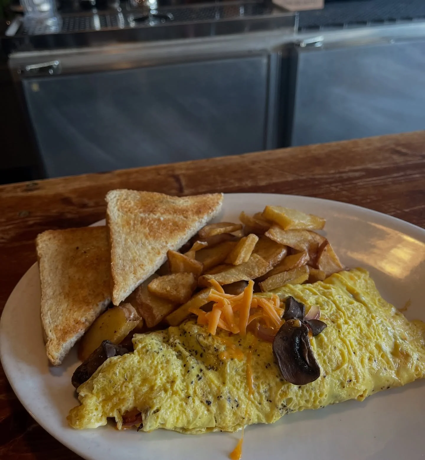 Cheddar Mushroom Omelette π‍π«π§ 
~ gooey cheddar cheese and sautéed mushrooms snuggled in a 3-egg omelette—served with toast and our twice-fried breakfast potatoes ~