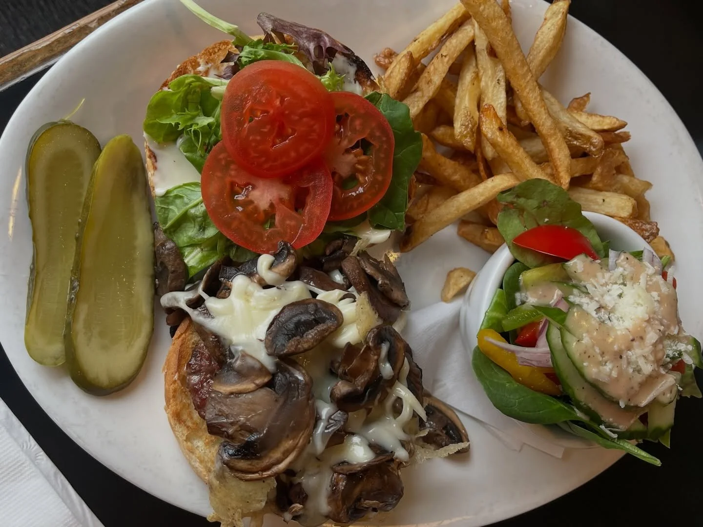 Colourful plates >>> 
This is our Mushroom Swiss Chargrilled Beef Burger!! Served with half salad and half hand-cut fries.