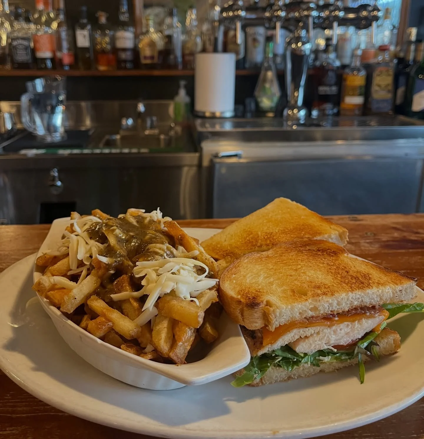Sourdough Grilled Chicken Club 🥪
~ made with real aged cheddar and Tipper&rsquo;s peppered bacon~ 
[Tipper&rsquo;s cheesy, vegetarian poutine on the side + $5)