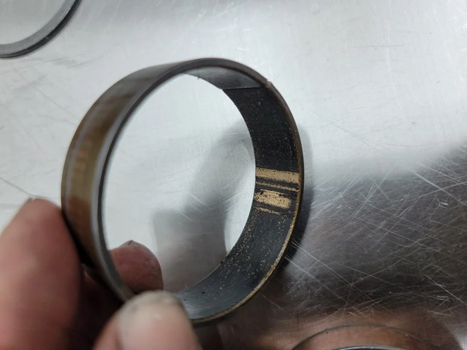 Pretty easy way to tell if there's a badly damaged fork tube. The knick will wipe the Teflon right off the bushing.