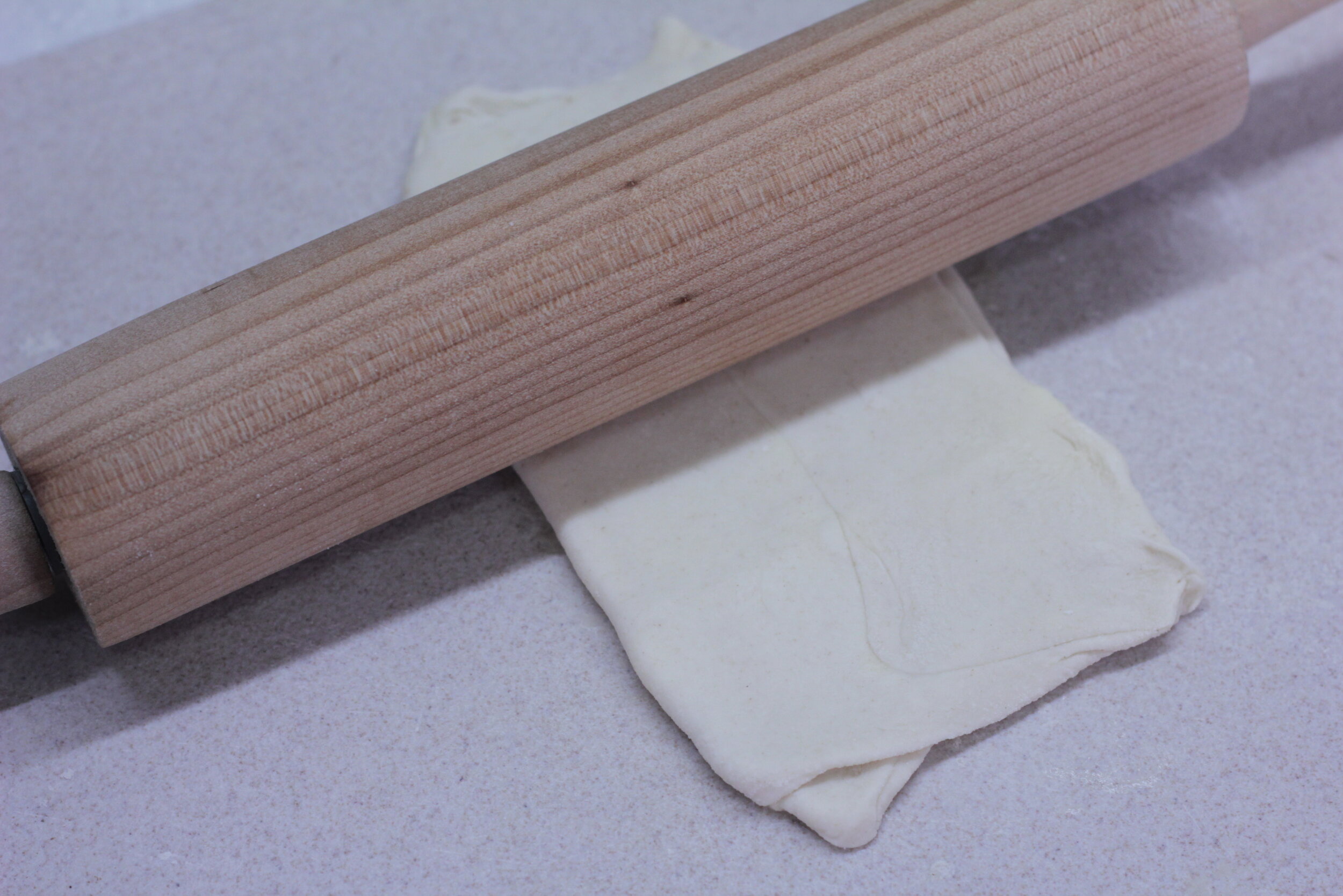  Step 8 - Rotate the dough 90 degrees, roll out a rectangular sheet again of 3-4mm thickness. Repeat step 5 
