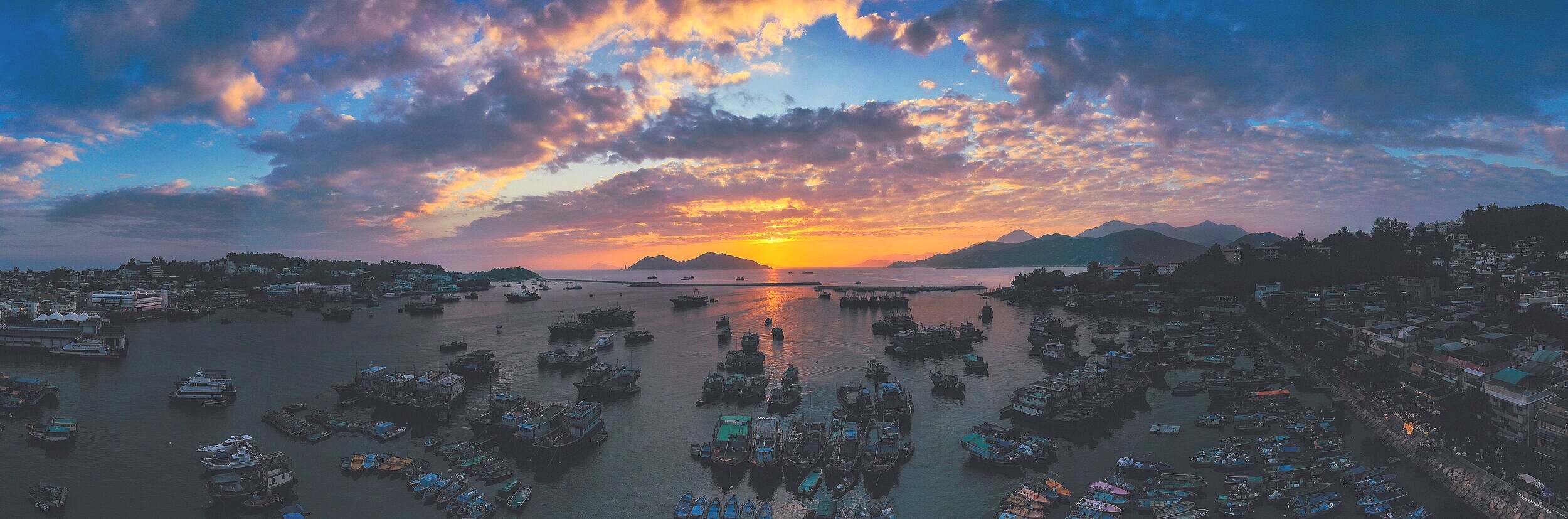 As the sun sets bringing the island of Cheung Chau into darkness