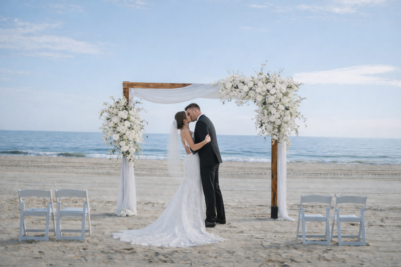 Large beach wedding arbor with customizable décor options and aisle decorations – 'Beach Package' by Barefoot Bride Weddings.