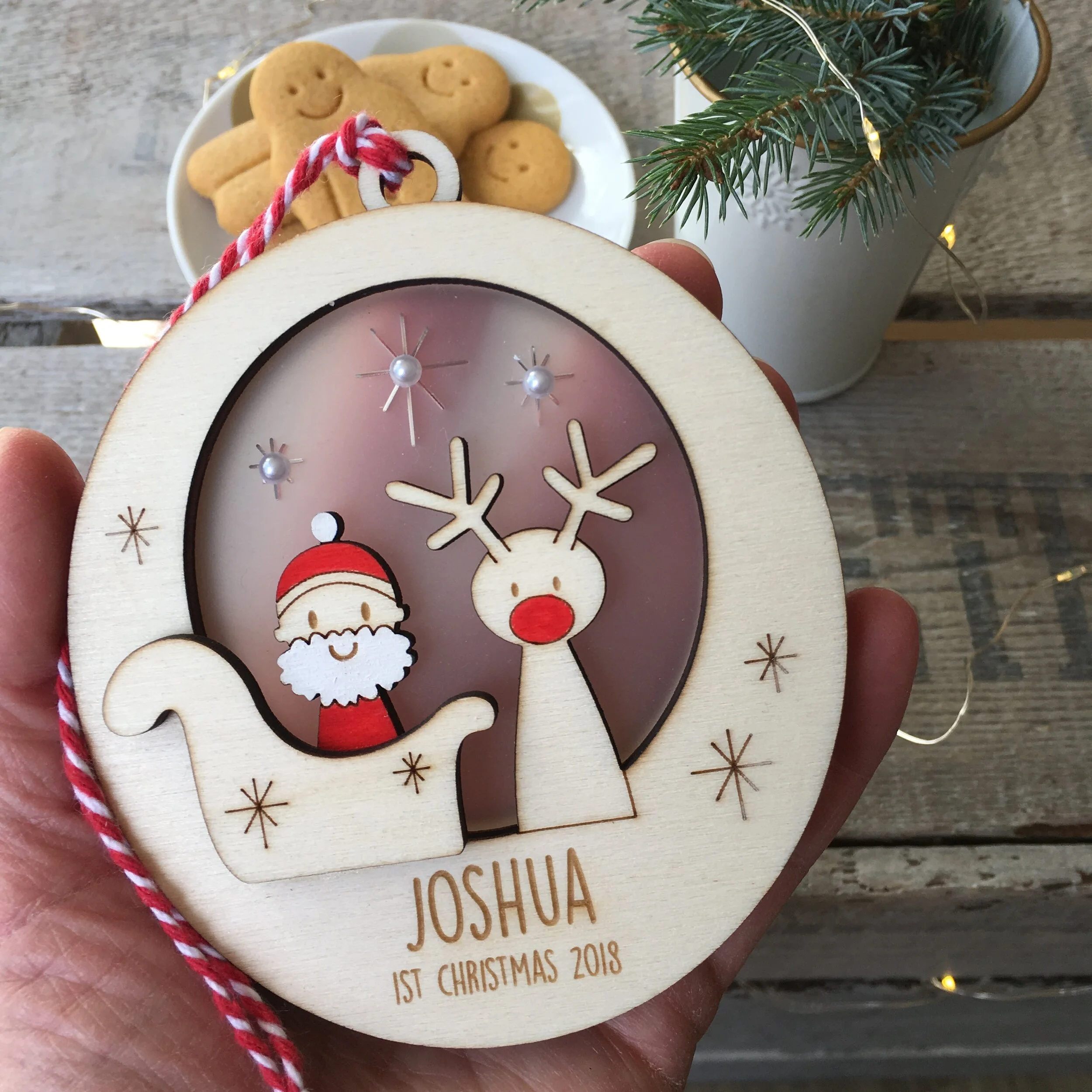 santa and rudolf bauble in hand.JPG