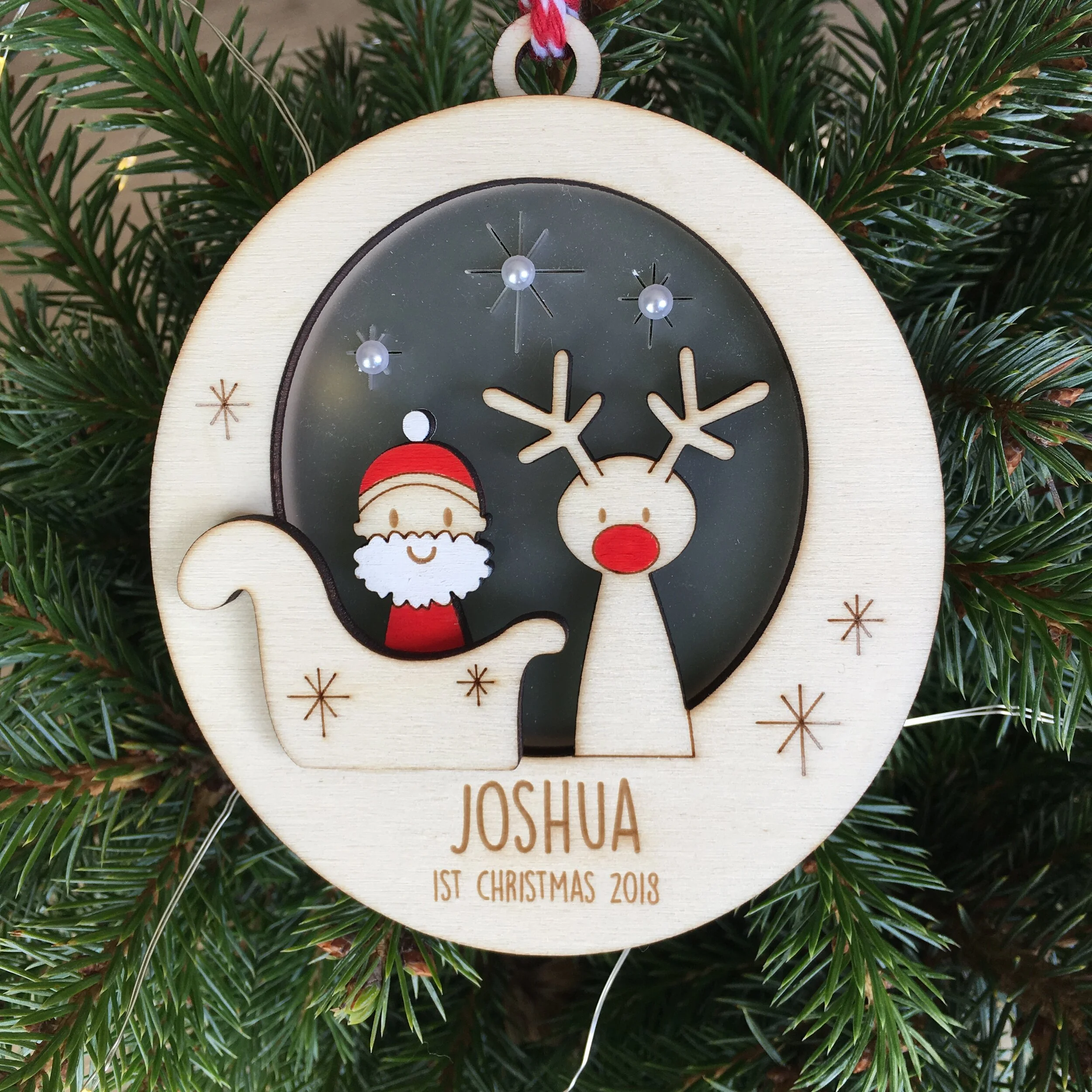 santa and rudolf bauble in a tree.JPG