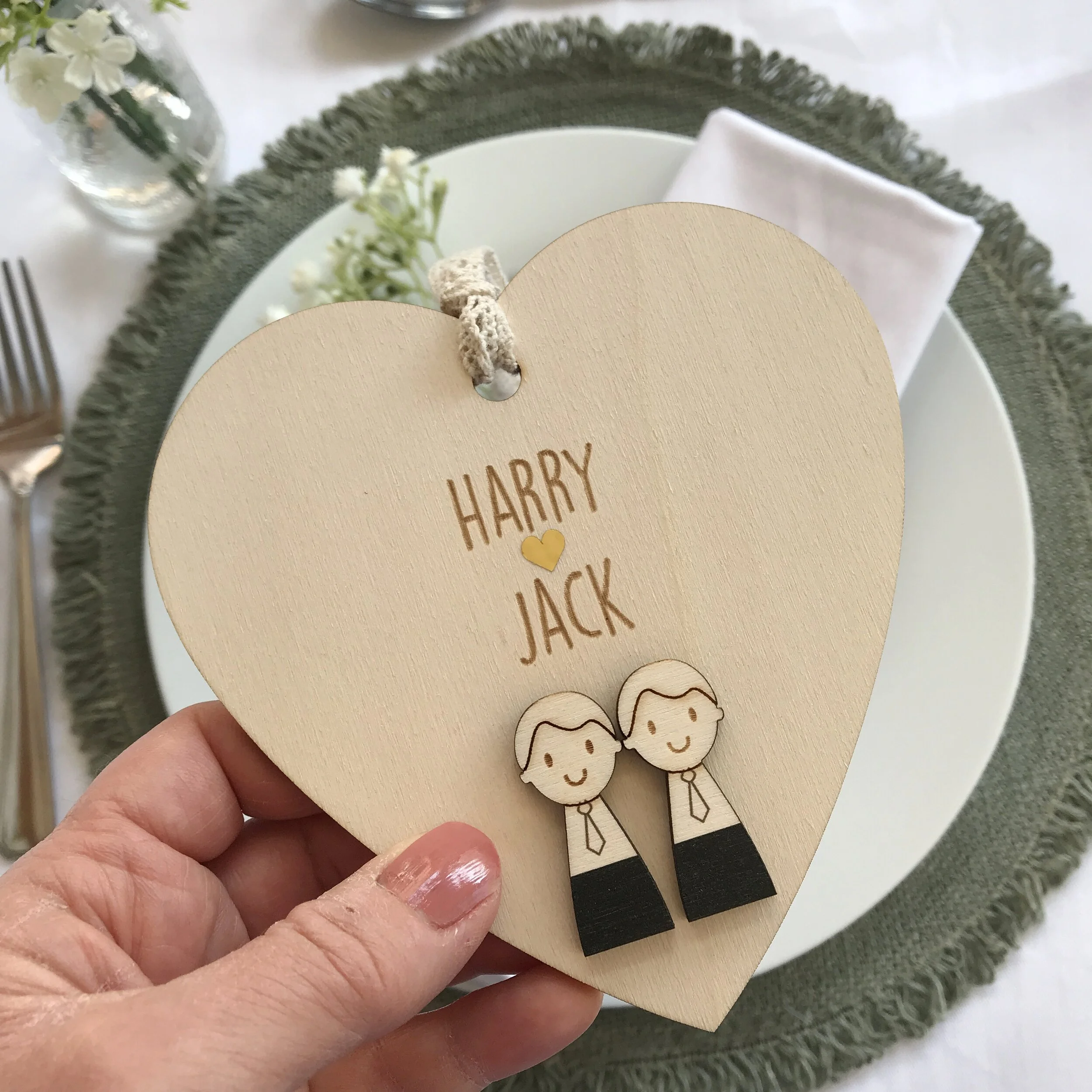 groom and groom heart main image in hand.JPG