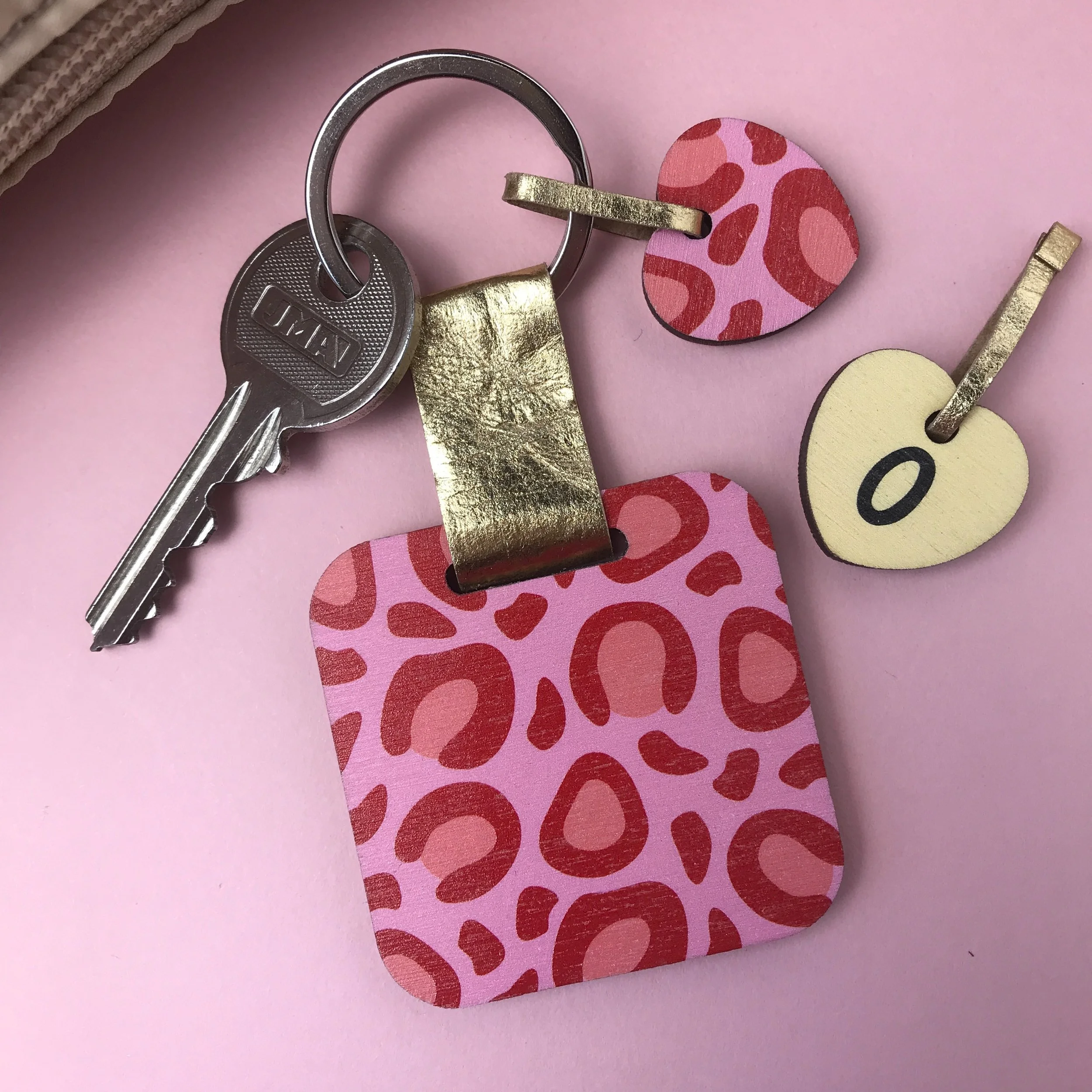 pink and red leopard print keyring with initial tag.JPG