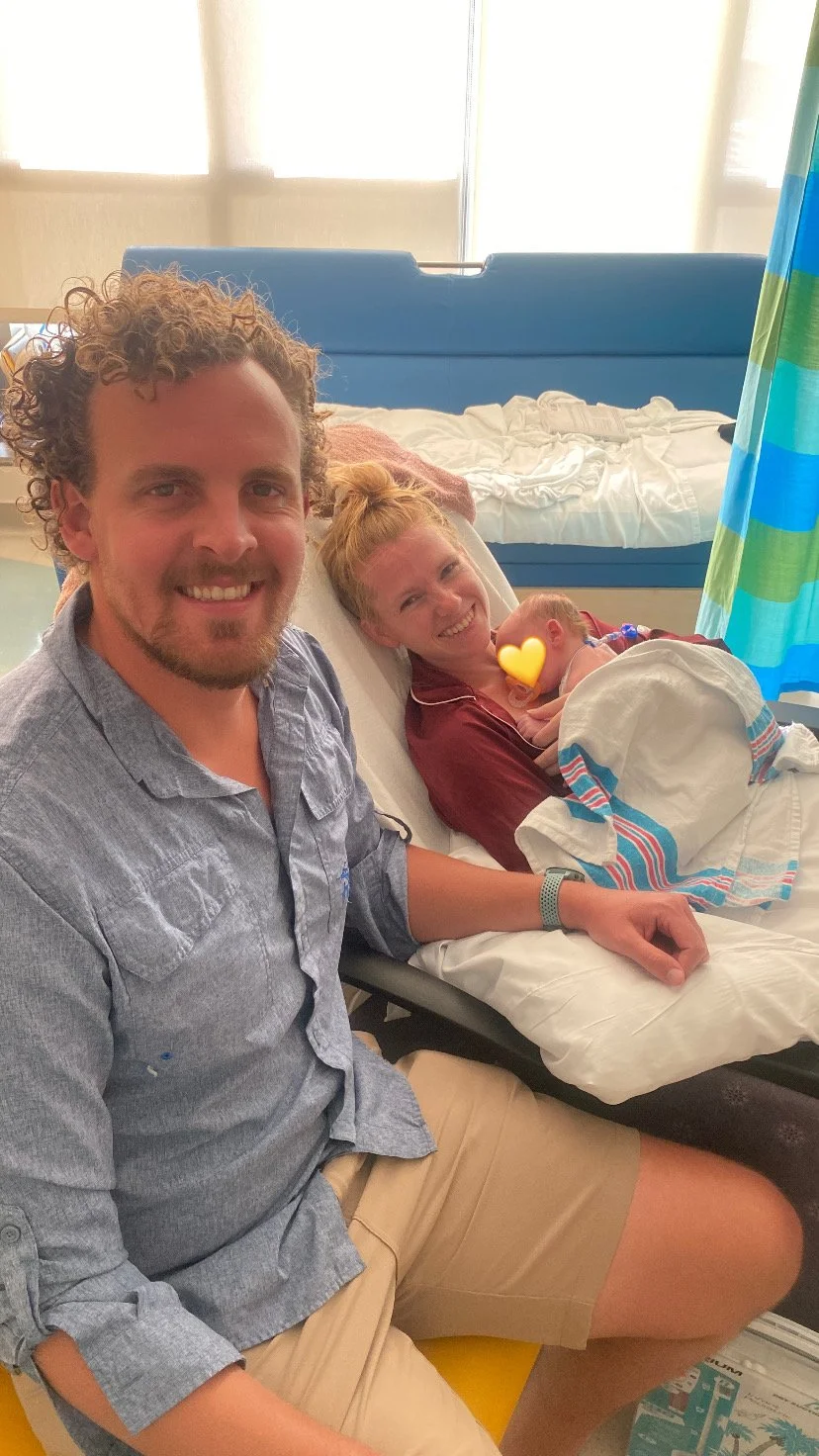 holding Teddy for first time.JPG