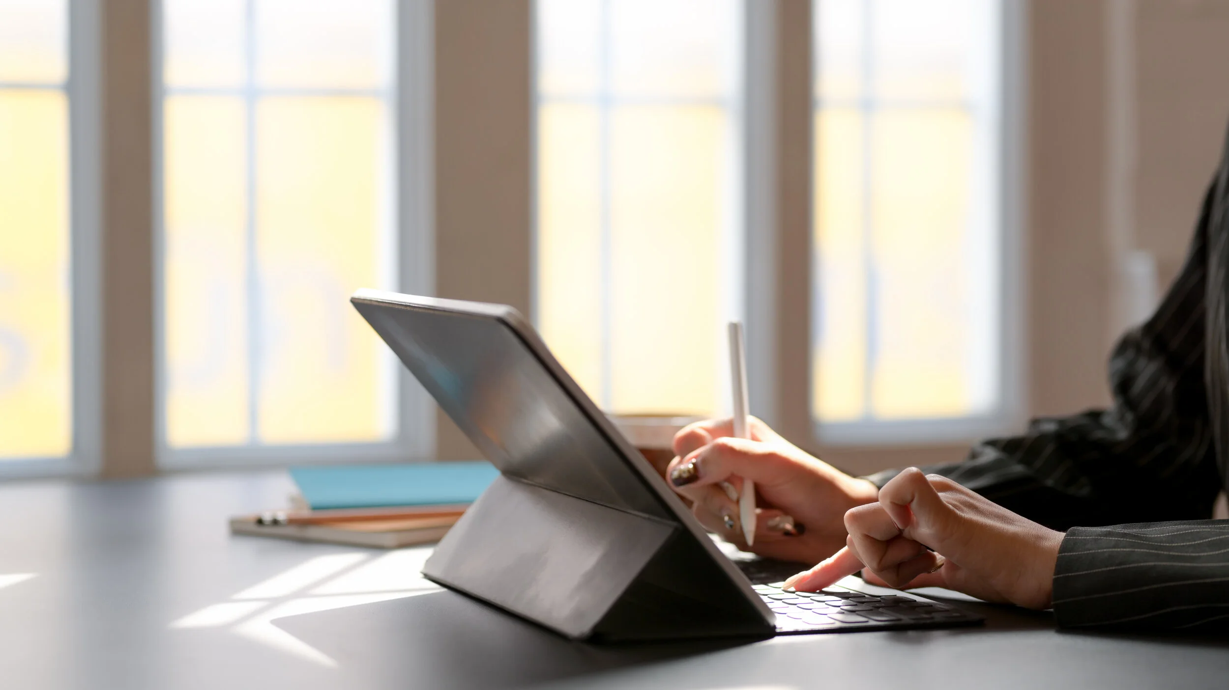 Canva - Person Using Tablet Computer With Keyboard.jpg