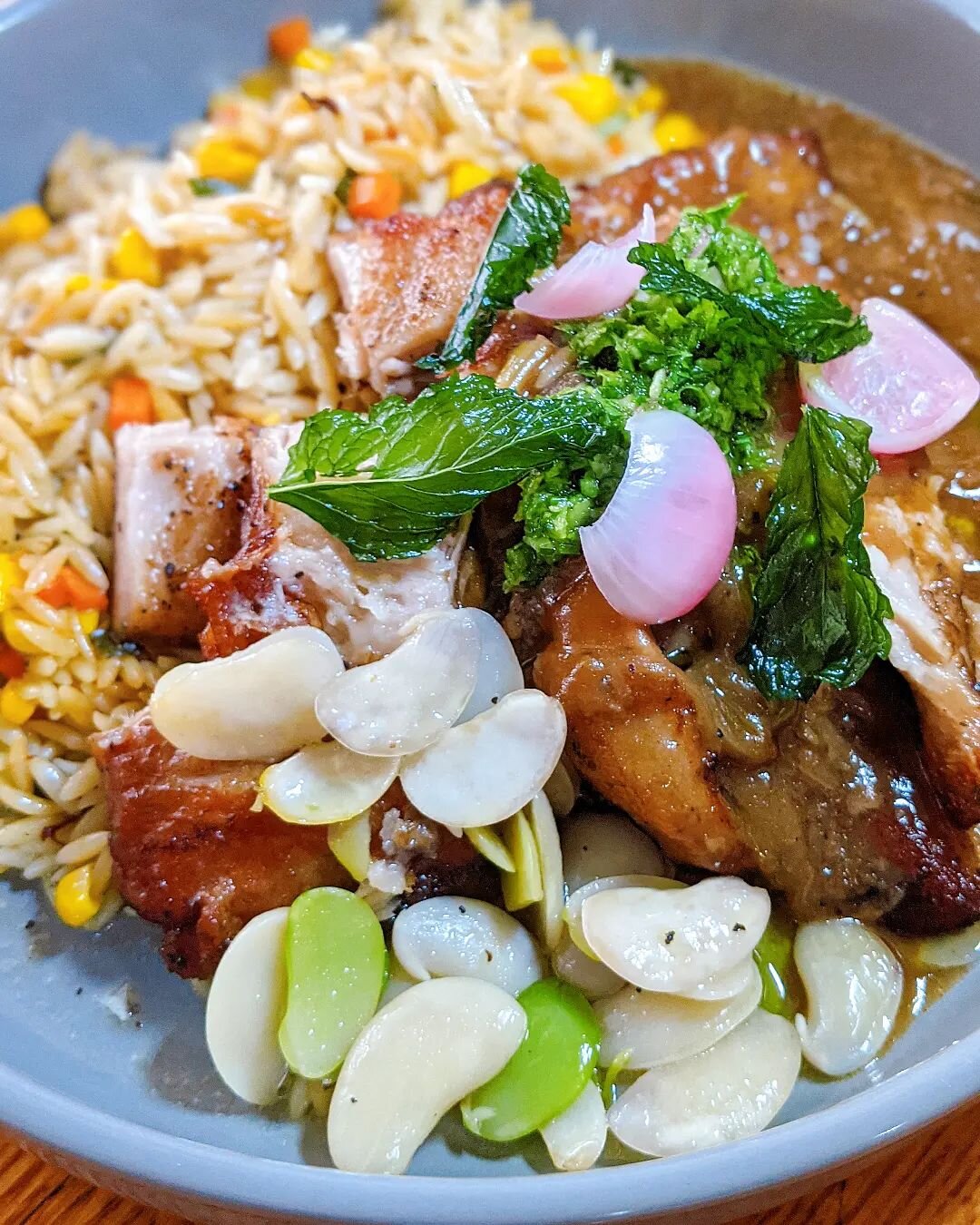 September special: &quot;Pork jowl&quot;

Braised pork jowl, orzo fried rice, feva beans, green salad and kimchi.

Perfect for pork lovers🐷

#okims #hawaii #oahu #okimshonolulu #onogrinds #delicious #honolulufoodies #hawaiirestaurants #hawaiieats #h