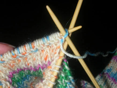 Slipping the first stitch of row two (wrong side)