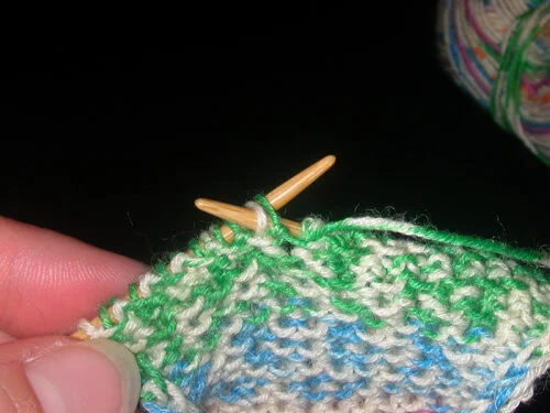 Purling 2 together as one (insert your working needle into TWO stitches and purl them together as one.)