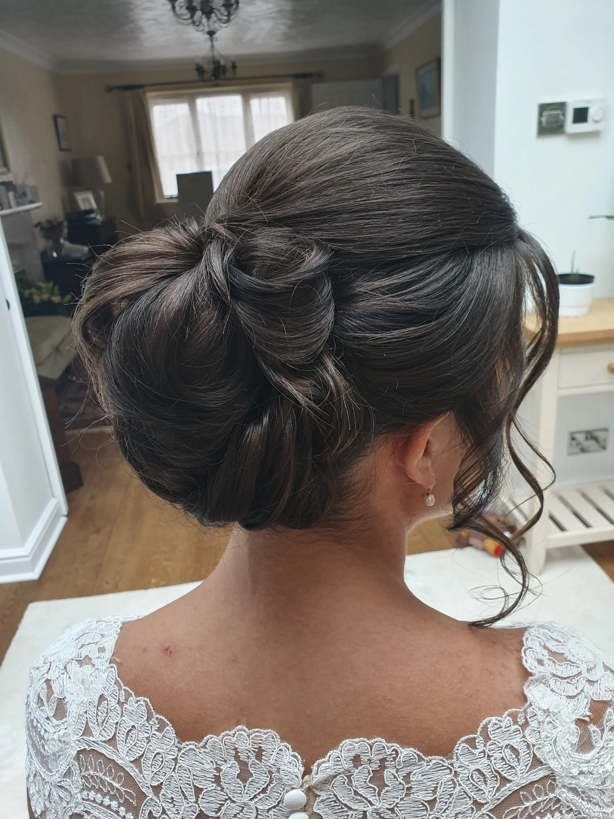  centeral bun with sweeping sides hair up bride